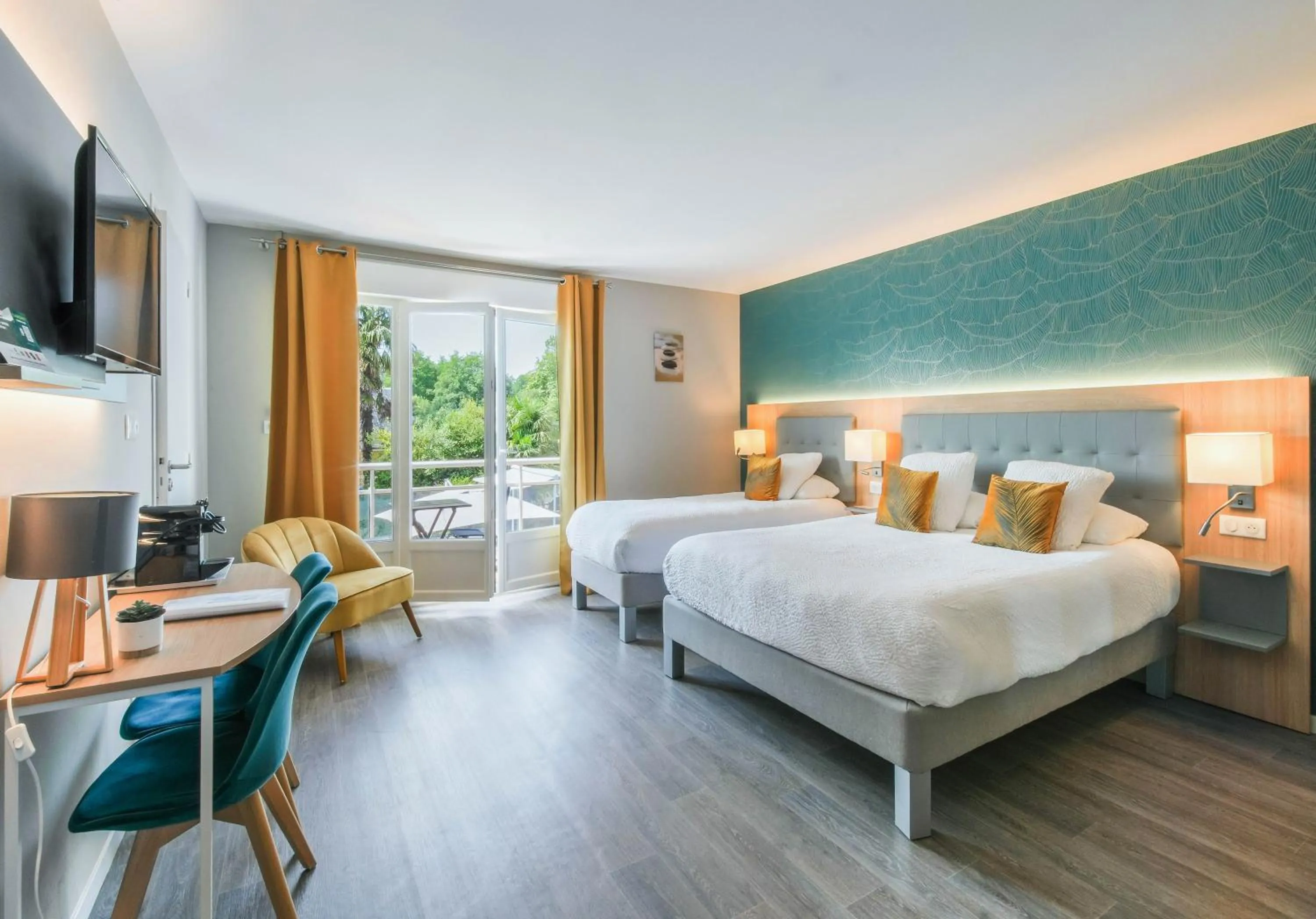 Bed in Logis Hôtel l'Amandier