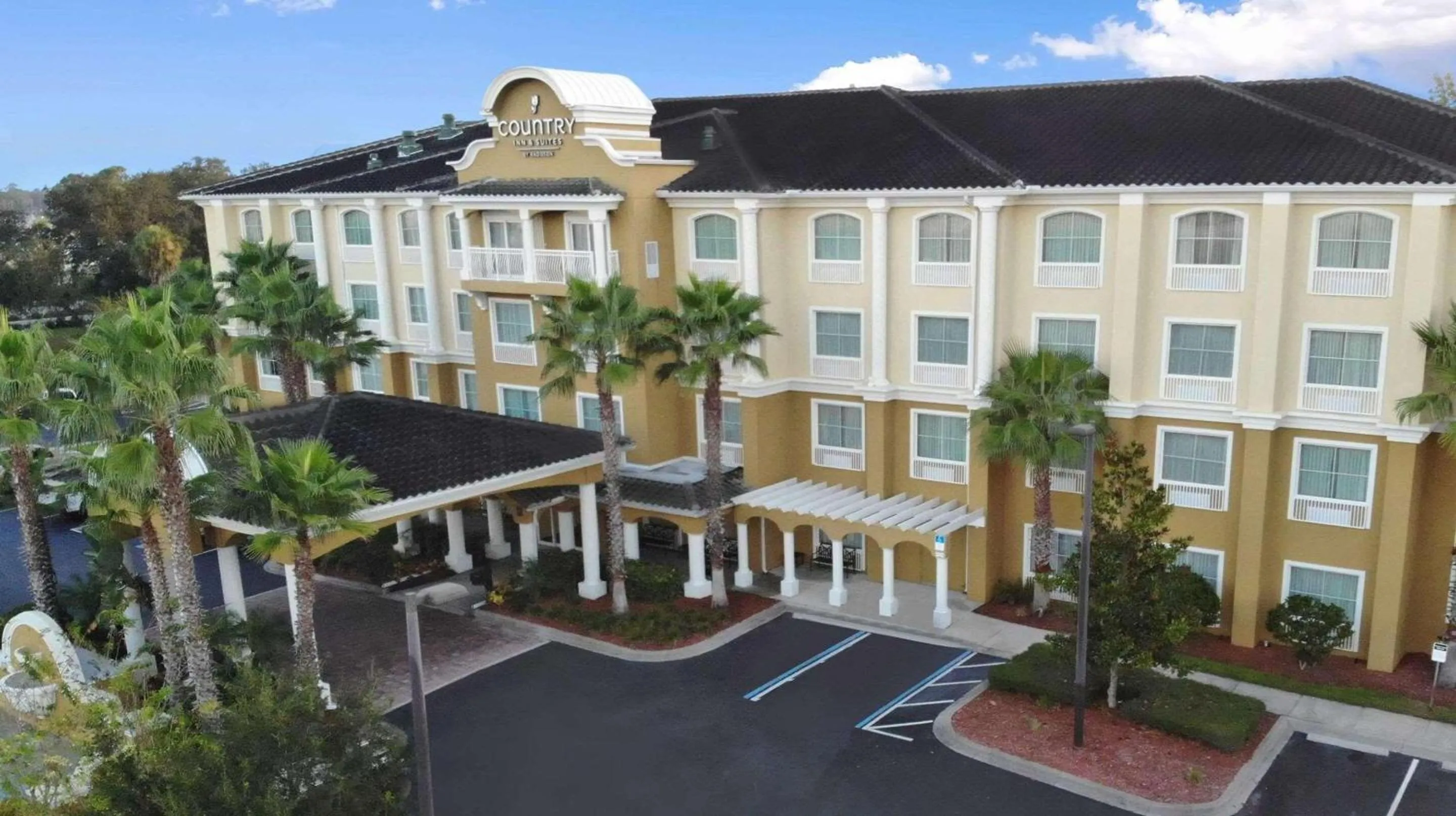 Property building in Country Inn & Suites by Radisson, Port Orange-Daytona, FL