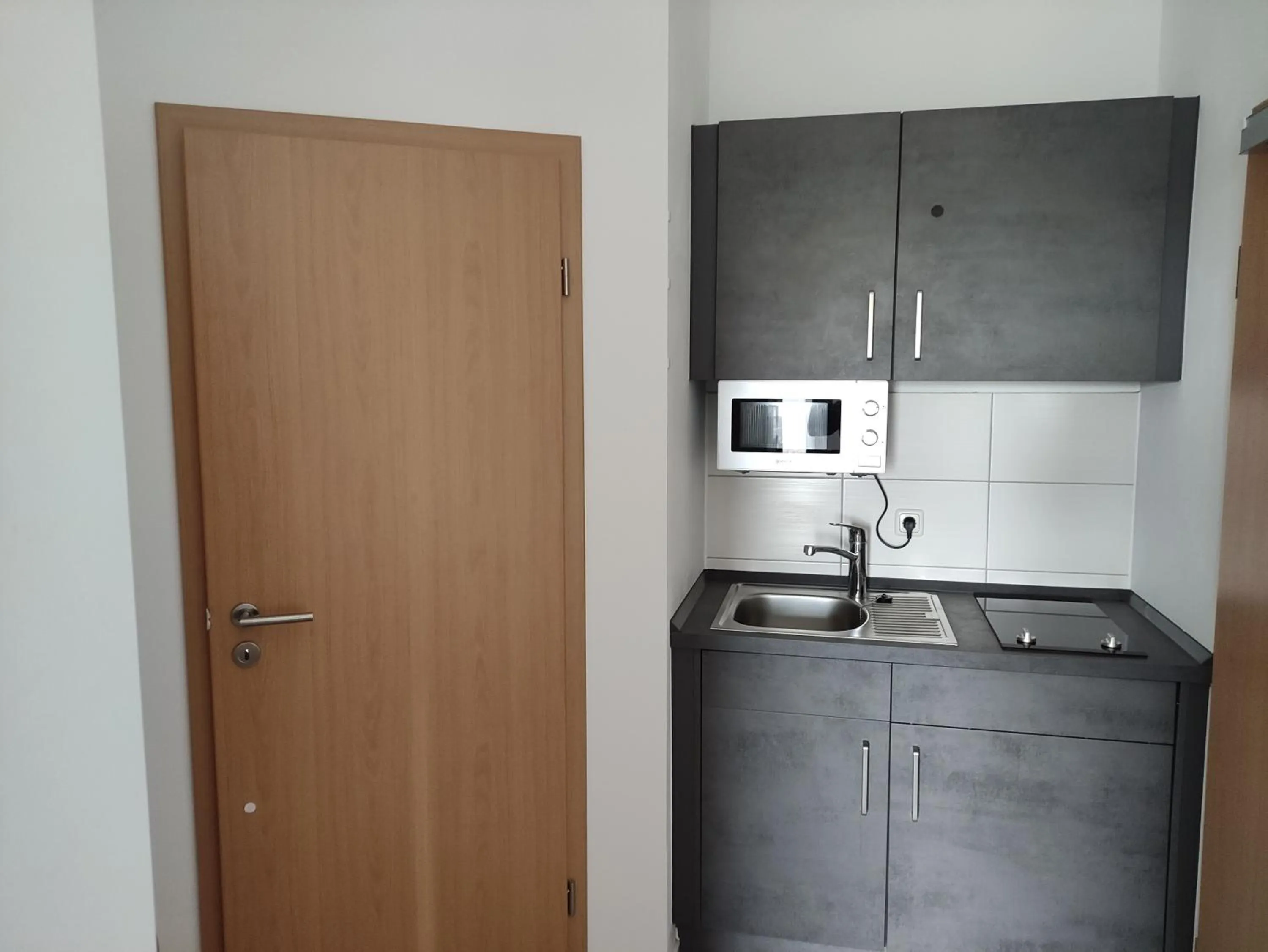 Kitchen or kitchenette in Appart-Hotel Harmonie