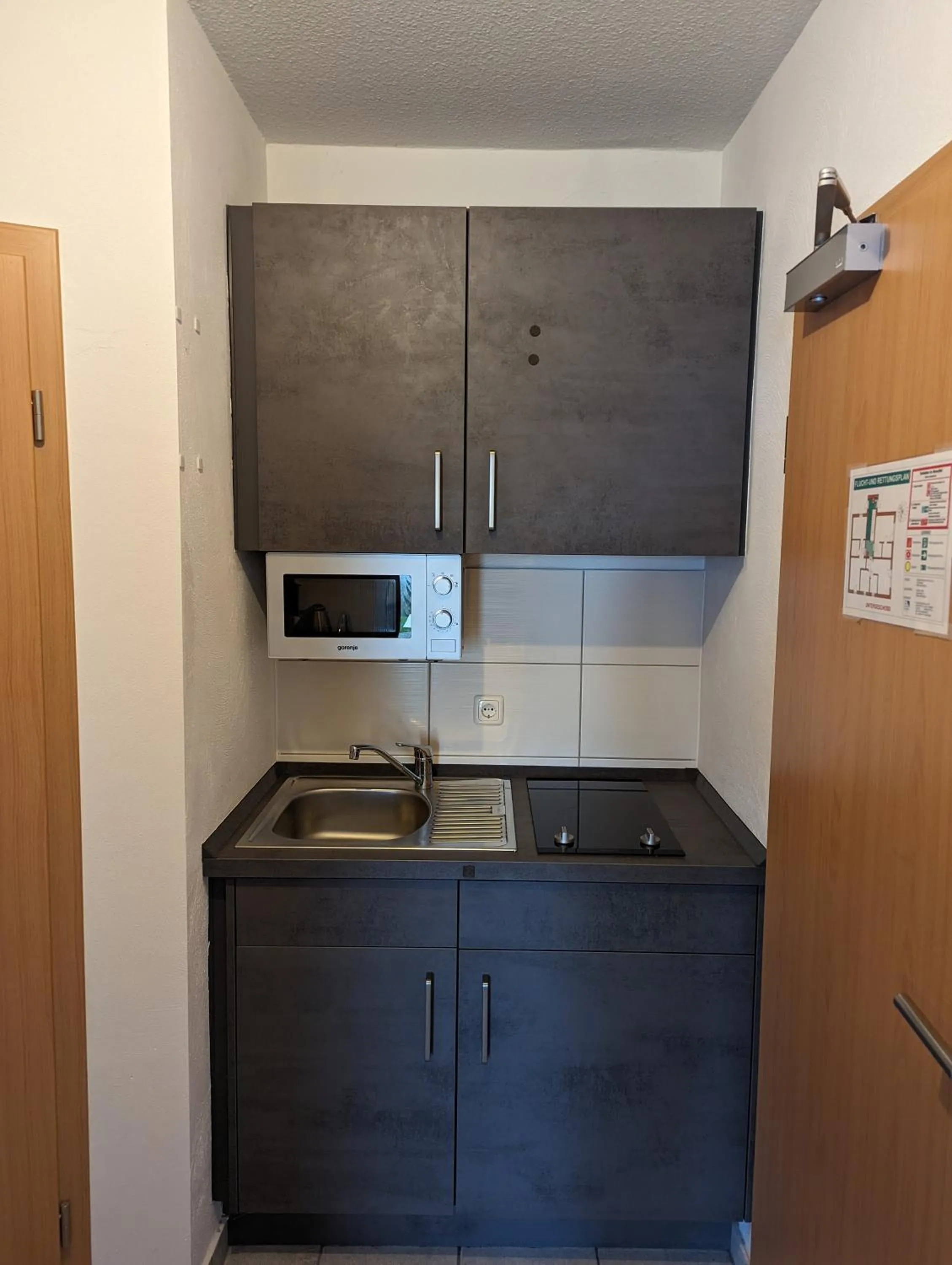 Kitchen or kitchenette in Appart-Hotel Harmonie