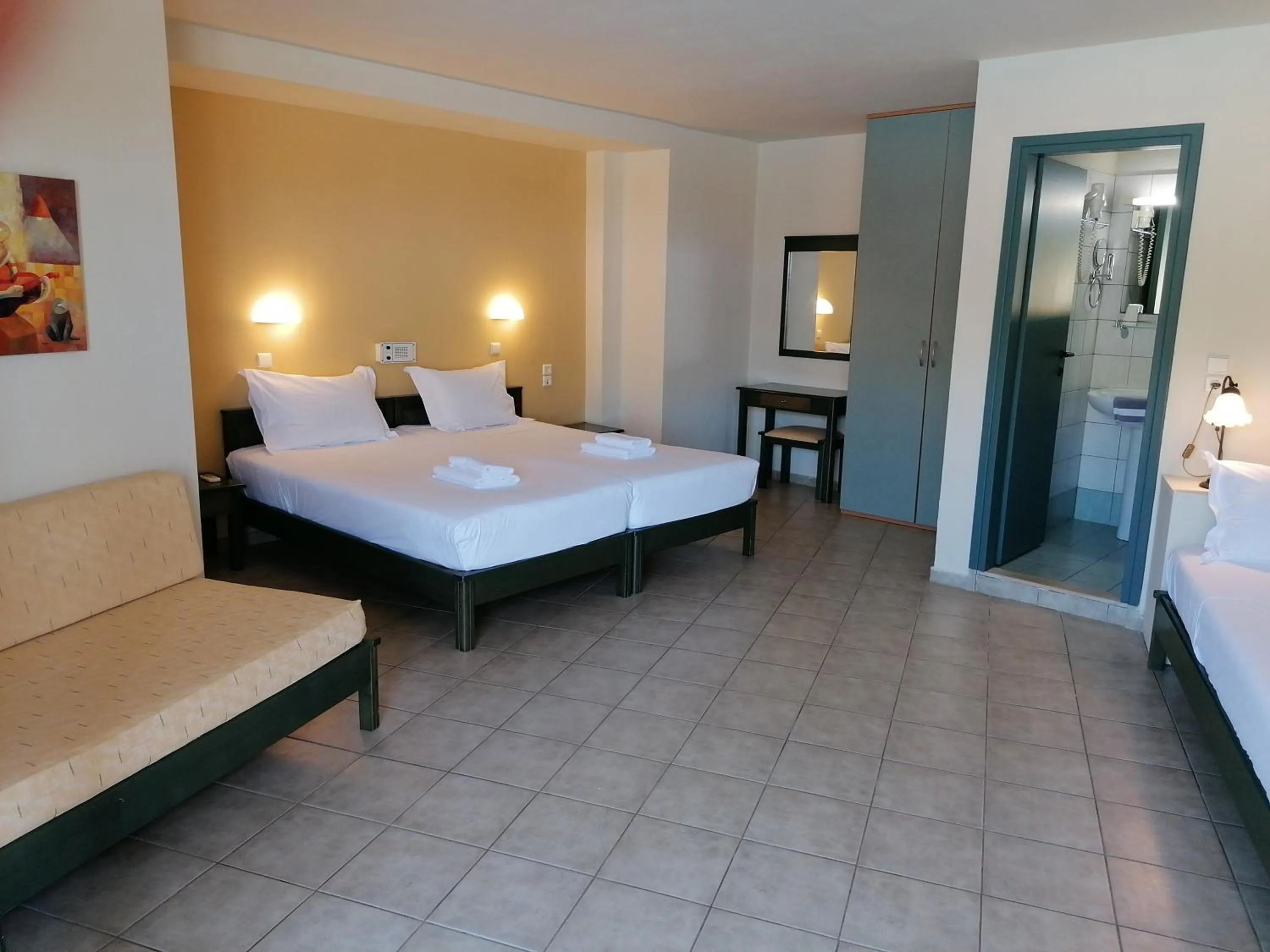 Bed in Villiana Holiday Apartments