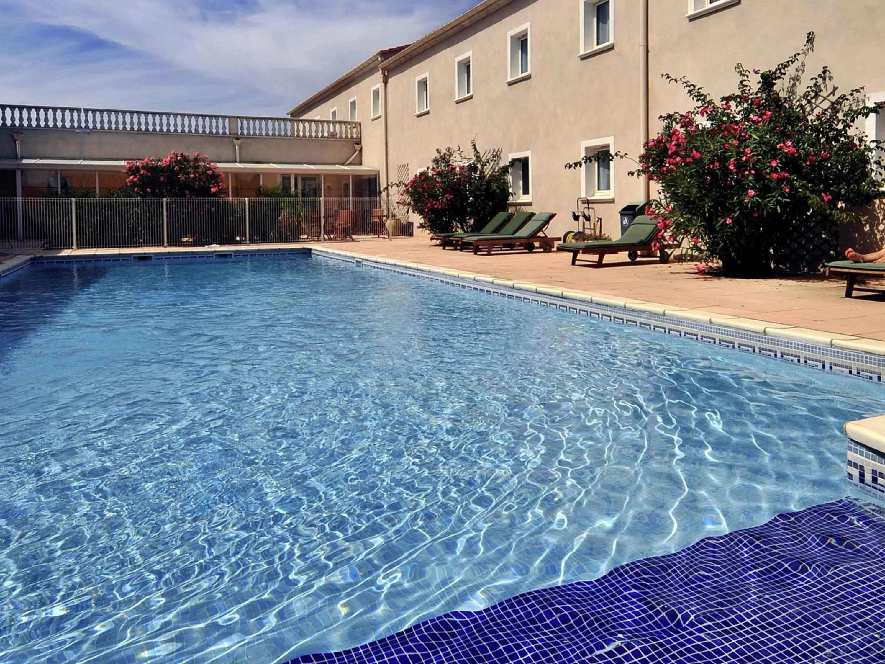 Pool view in ibis Orange Sud