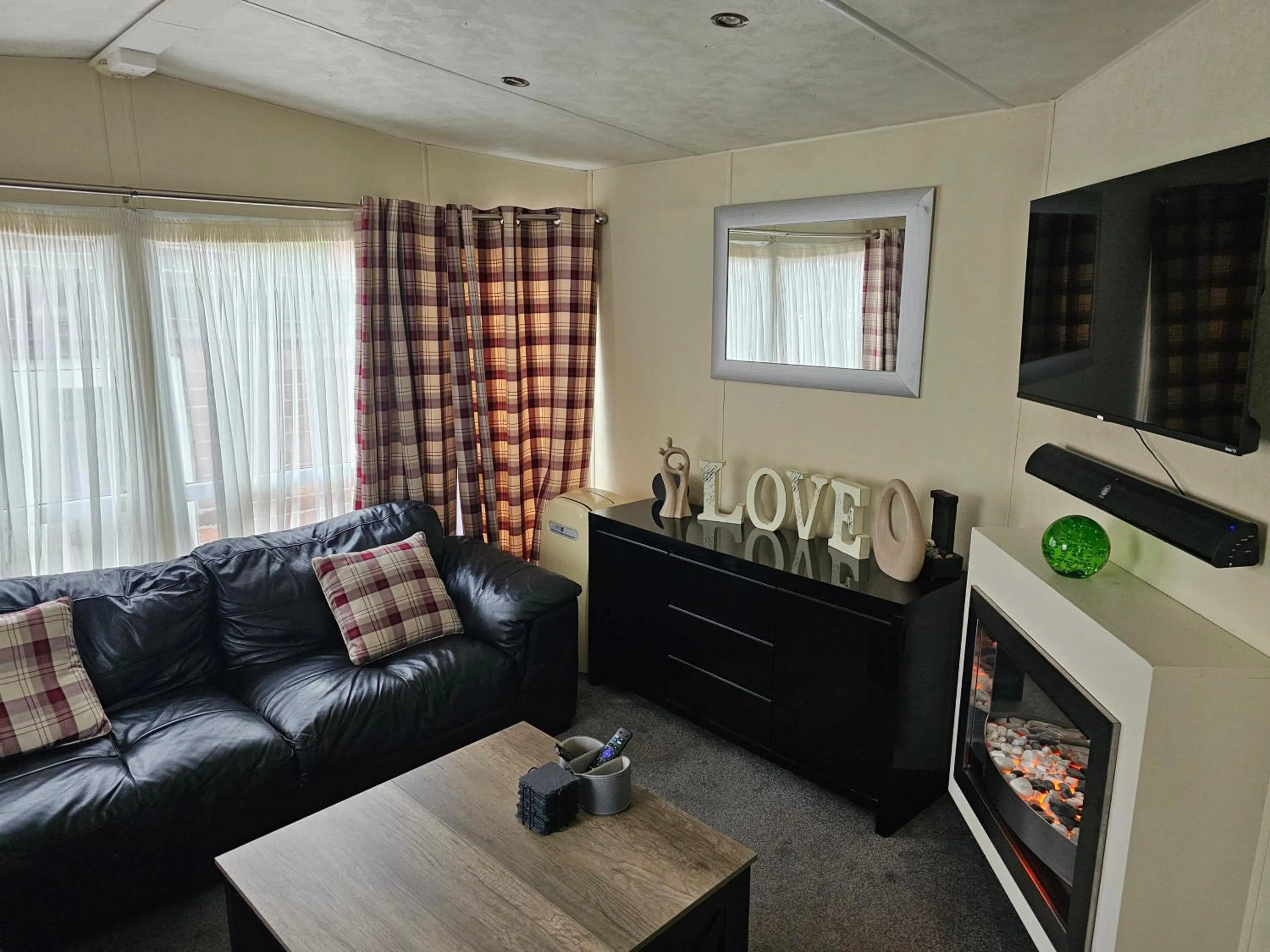 Communal lounge/ TV room in Tudor Lodge Hotel