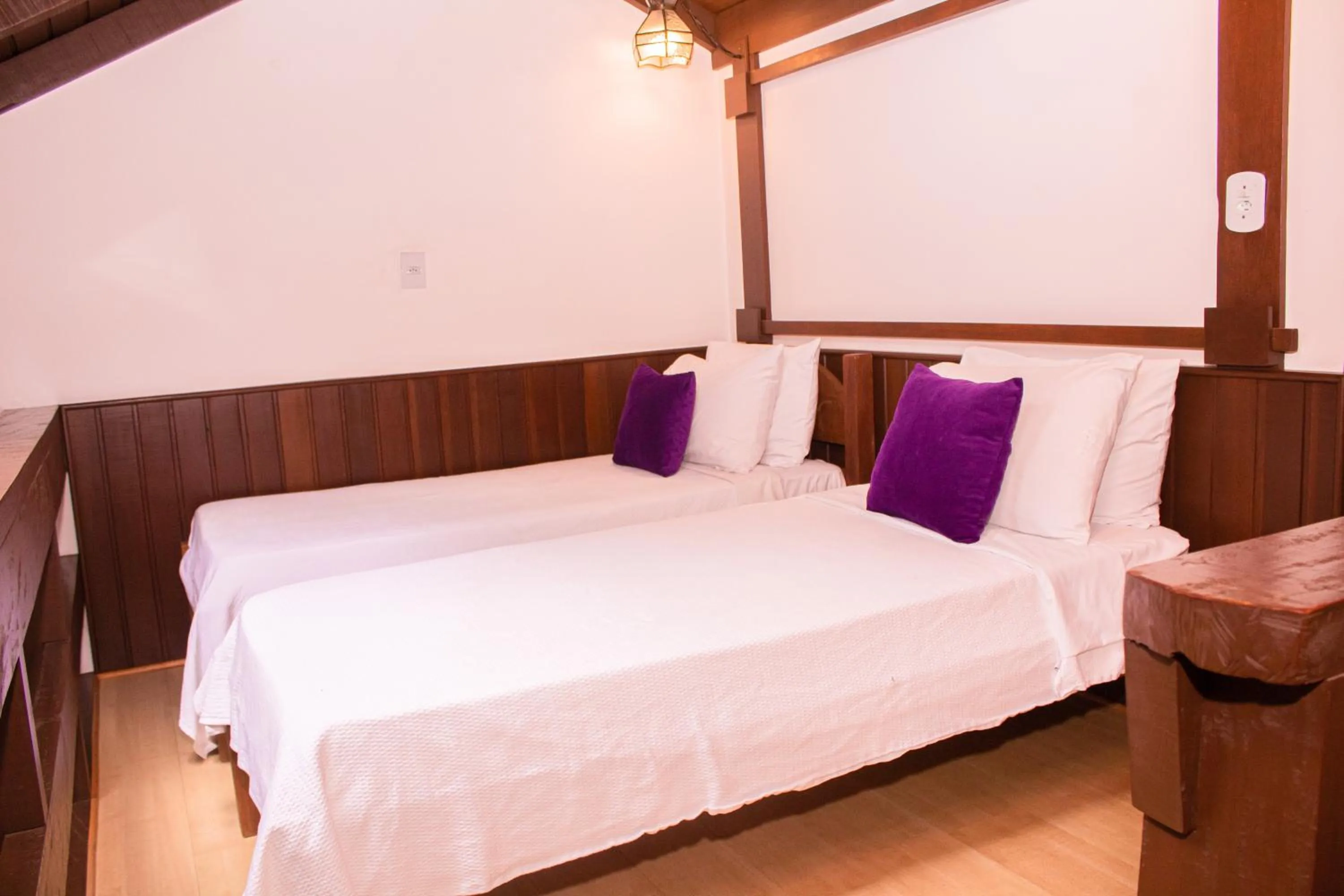 Bed in Pousada O Cantinho da Raposa