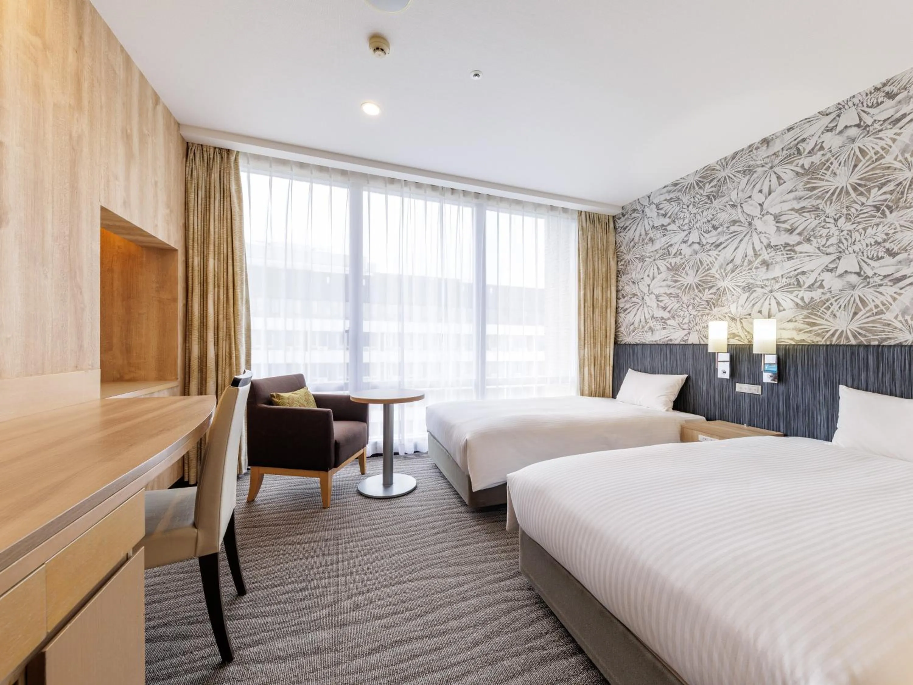 Bed in Nishitetsu Resort Inn Naha