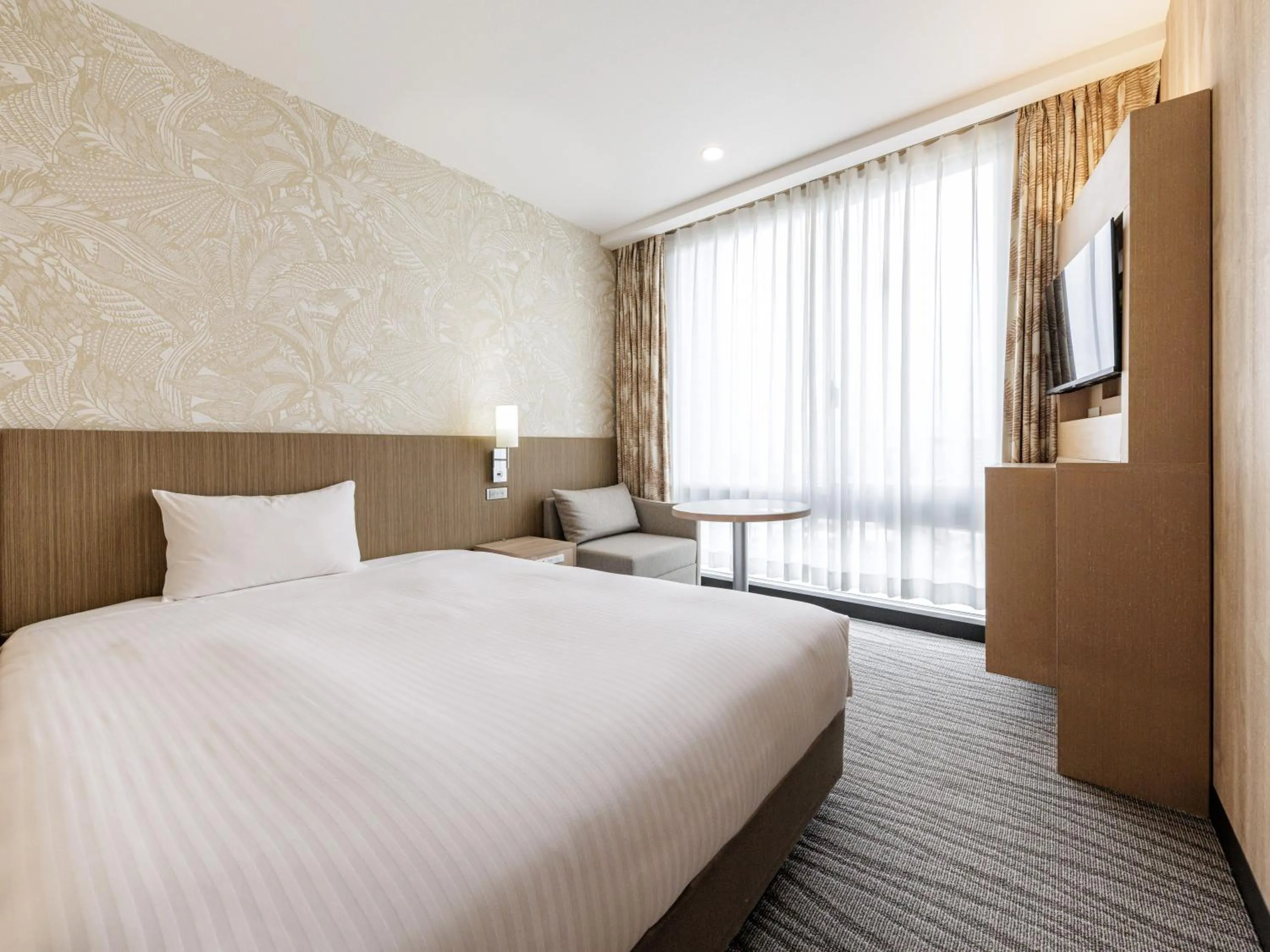 Bed in Nishitetsu Resort Inn Naha