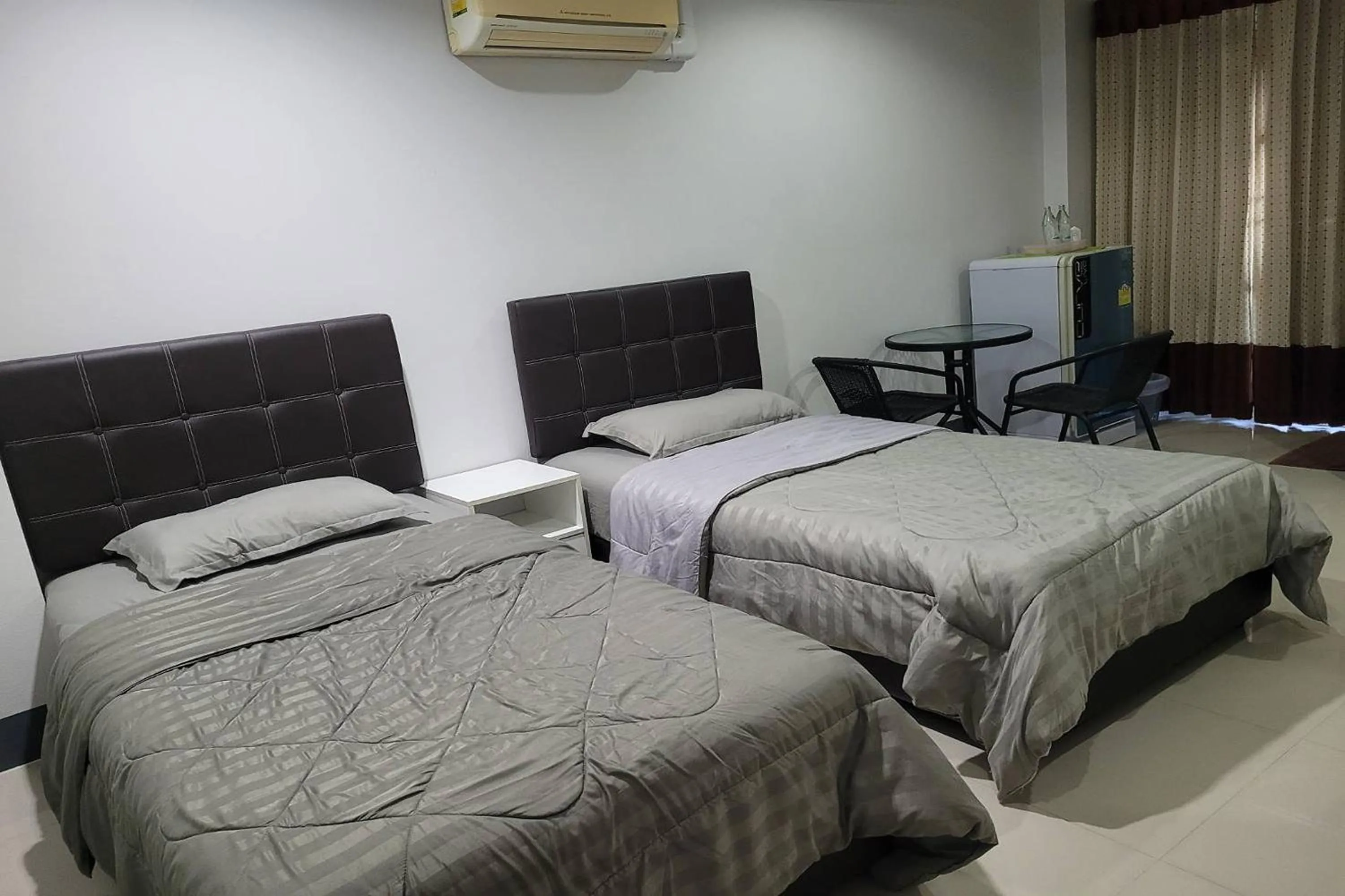 Bed in Kaewchantra Mansion