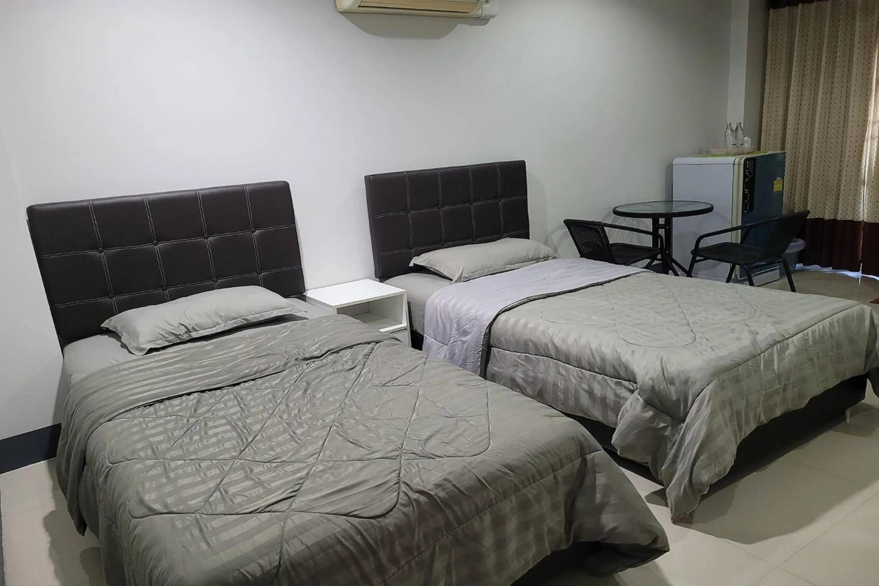 Bed in Kaewchantra Mansion