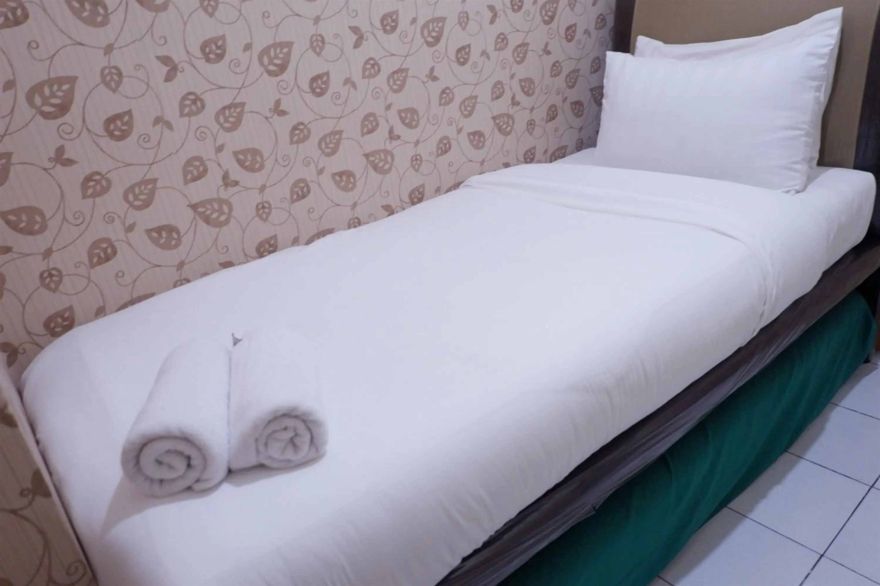 Bed in Strategic 2BR Menteng Square Apartment By Travelio