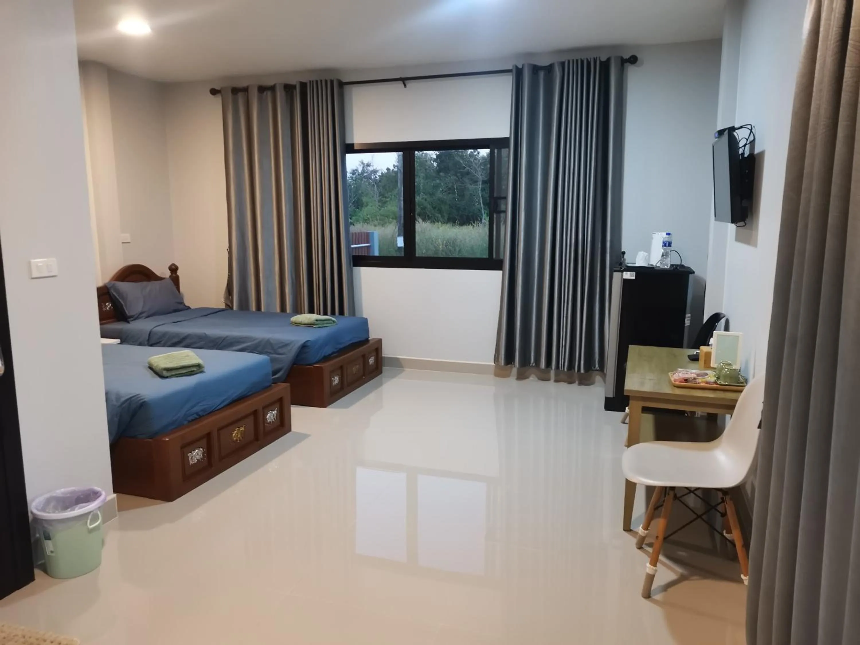 Seating area, Bed in Numhom Resort