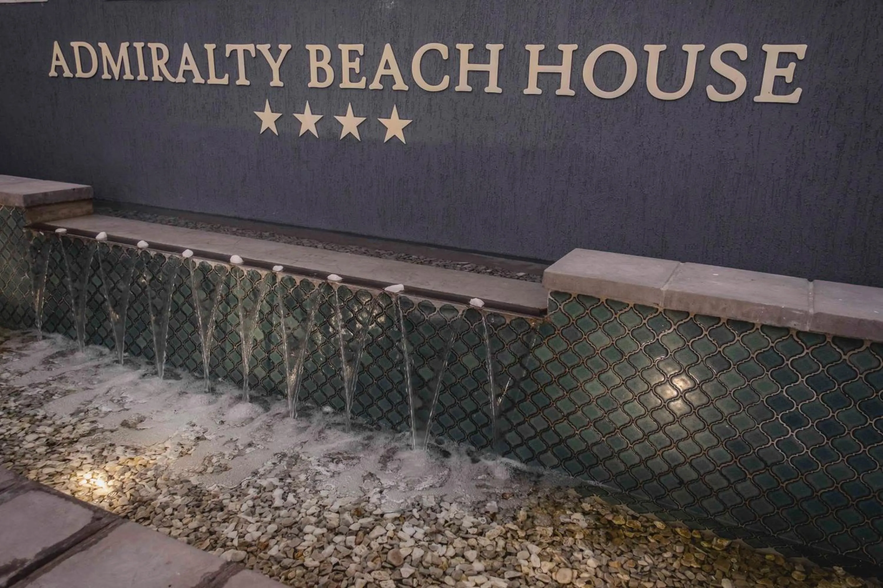 Property logo or sign in Admiralty Beach House