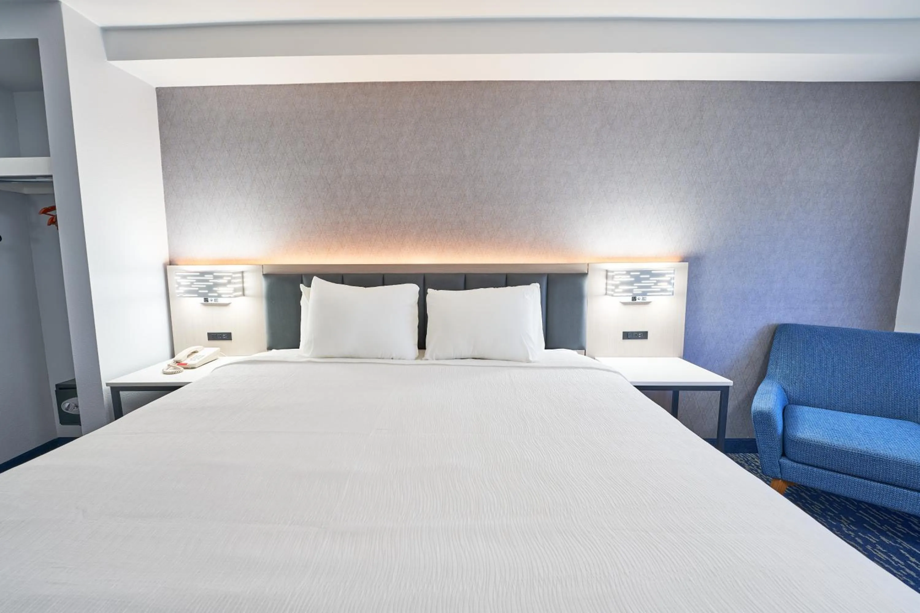 Bed in All Seasons Inn & Suites