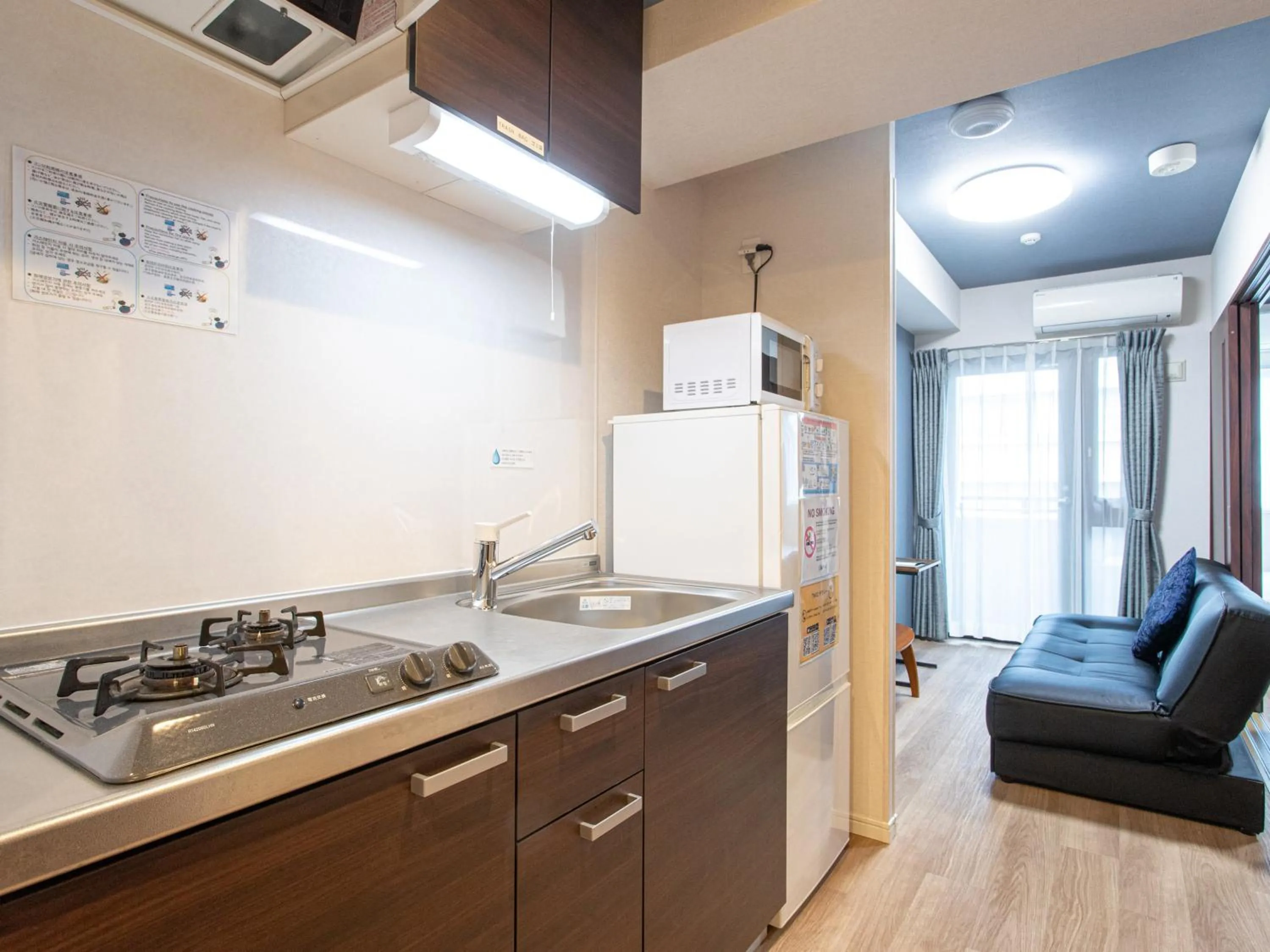 Kitchen or kitchenette in Dream Inn Hakata