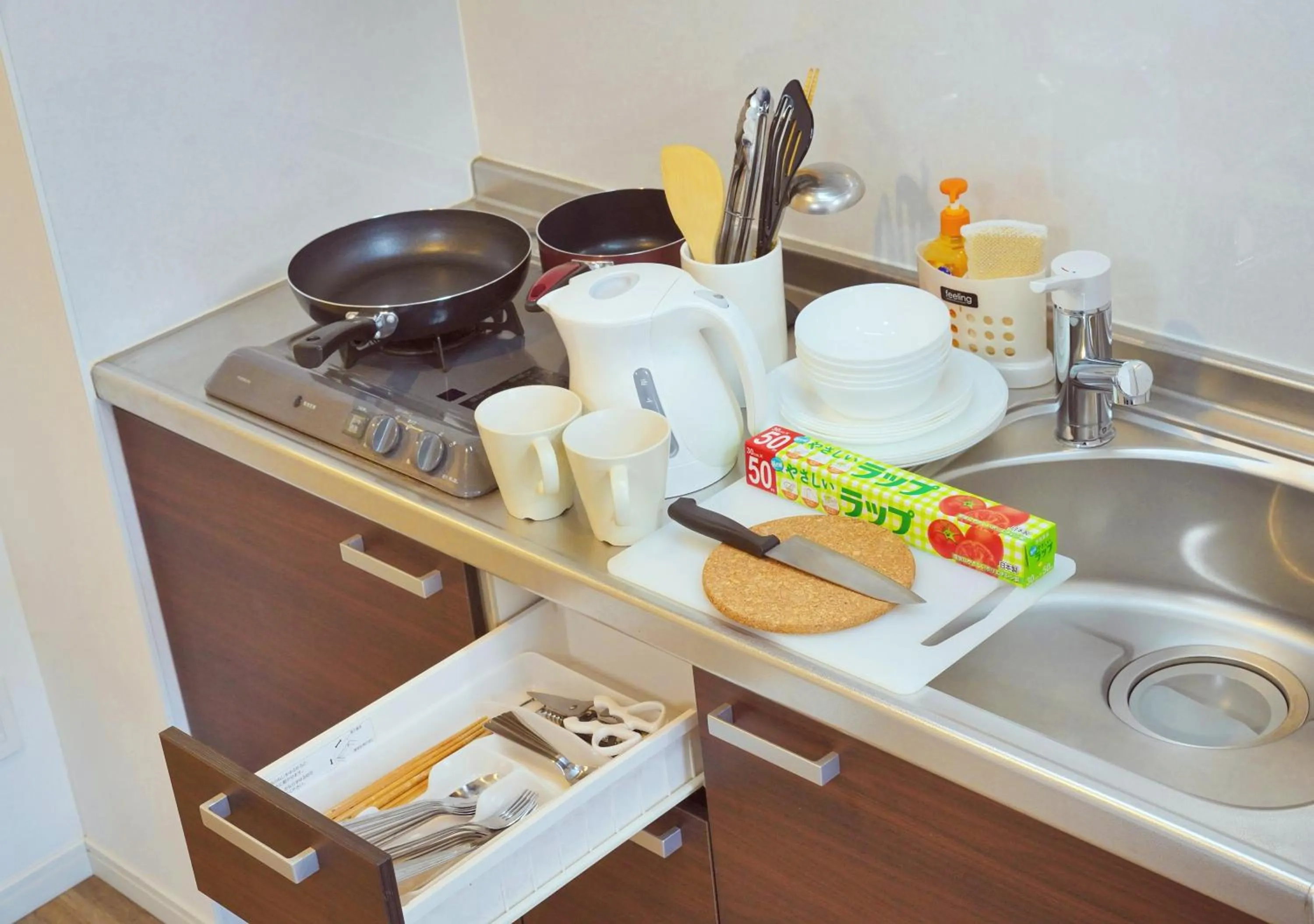 Kitchen or kitchenette in Dream Inn Hakata