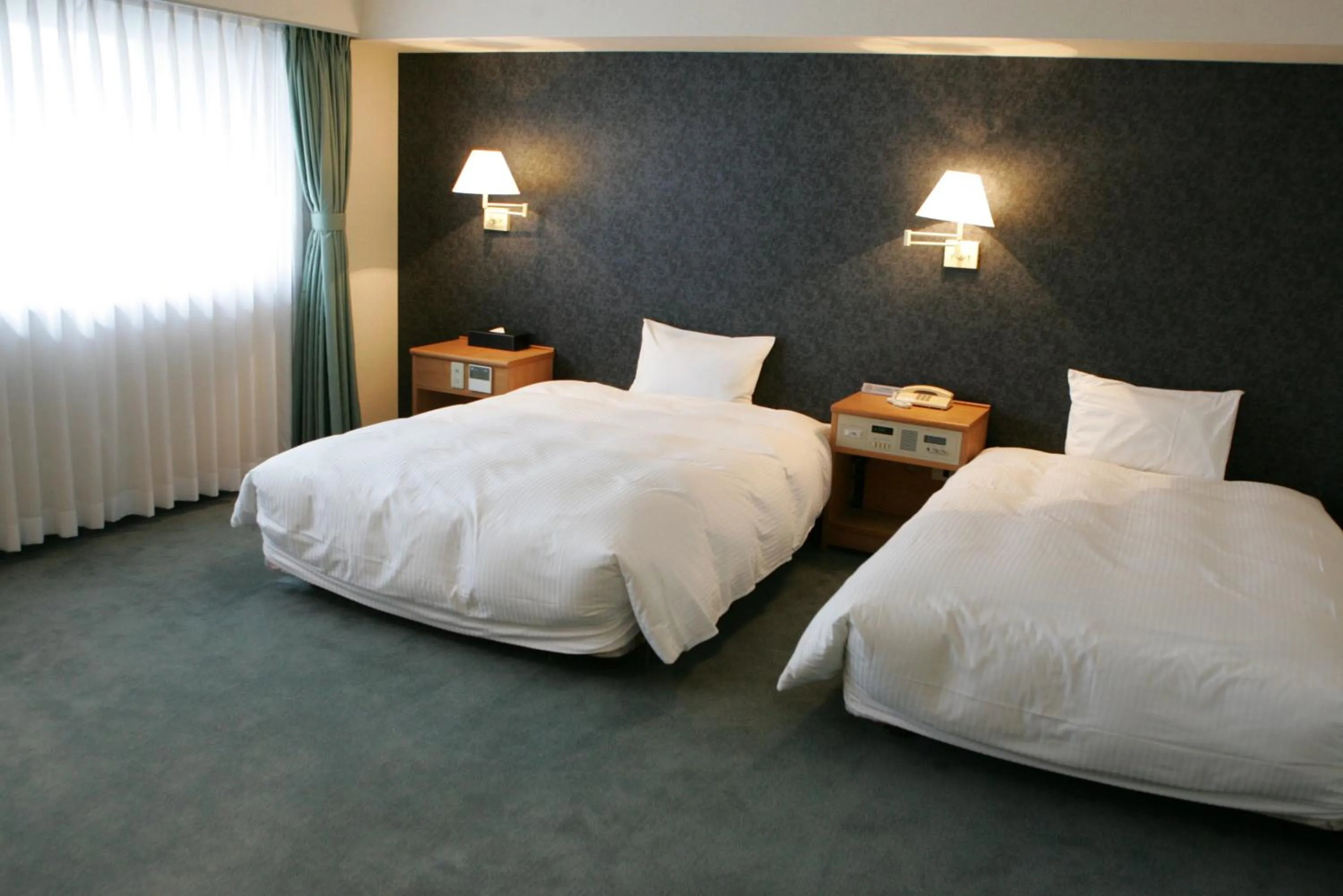 Photo of the whole room, Bed in Green Rich Hotel Nishitetsu Ohashi Ekimae