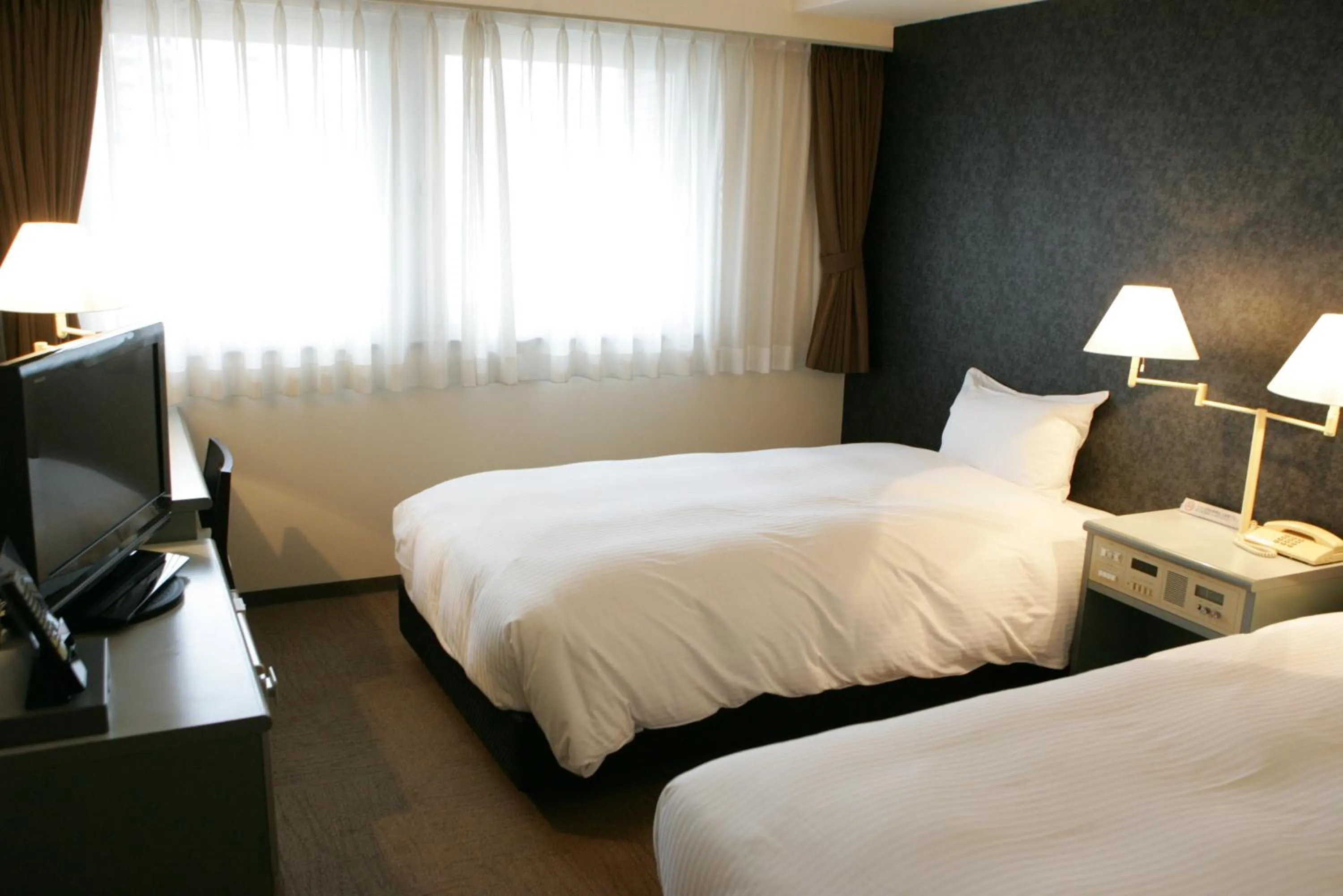 Photo of the whole room, Bed in Green Rich Hotel Nishitetsu Ohashi Ekimae