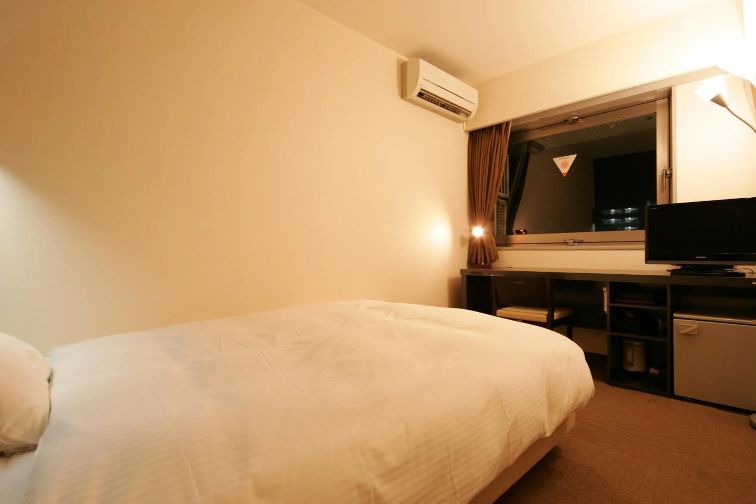 Photo of the whole room, Bed in Green Rich Hotel Nishitetsu Ohashi Ekimae
