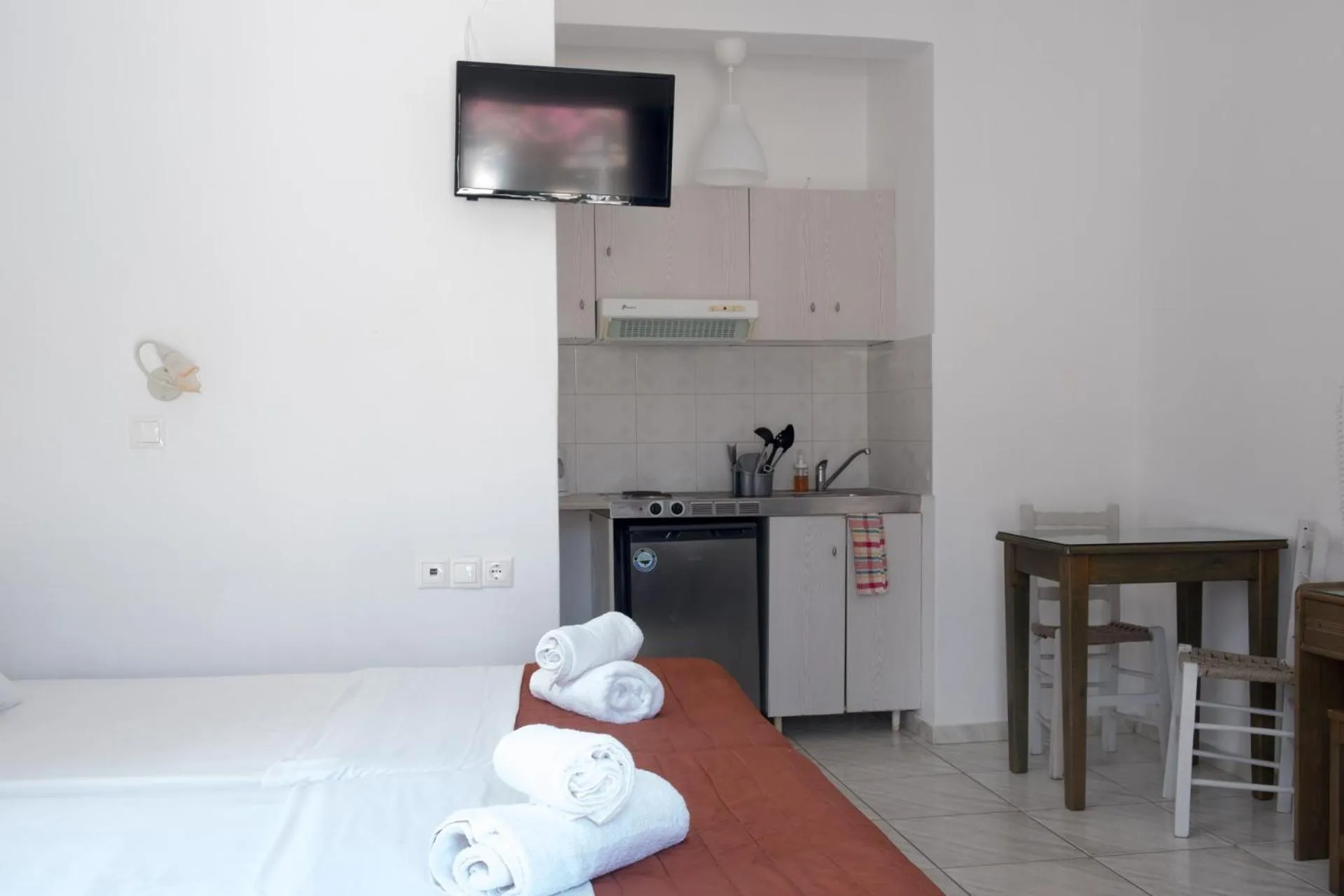 Bed in Paradise Apartments Studios