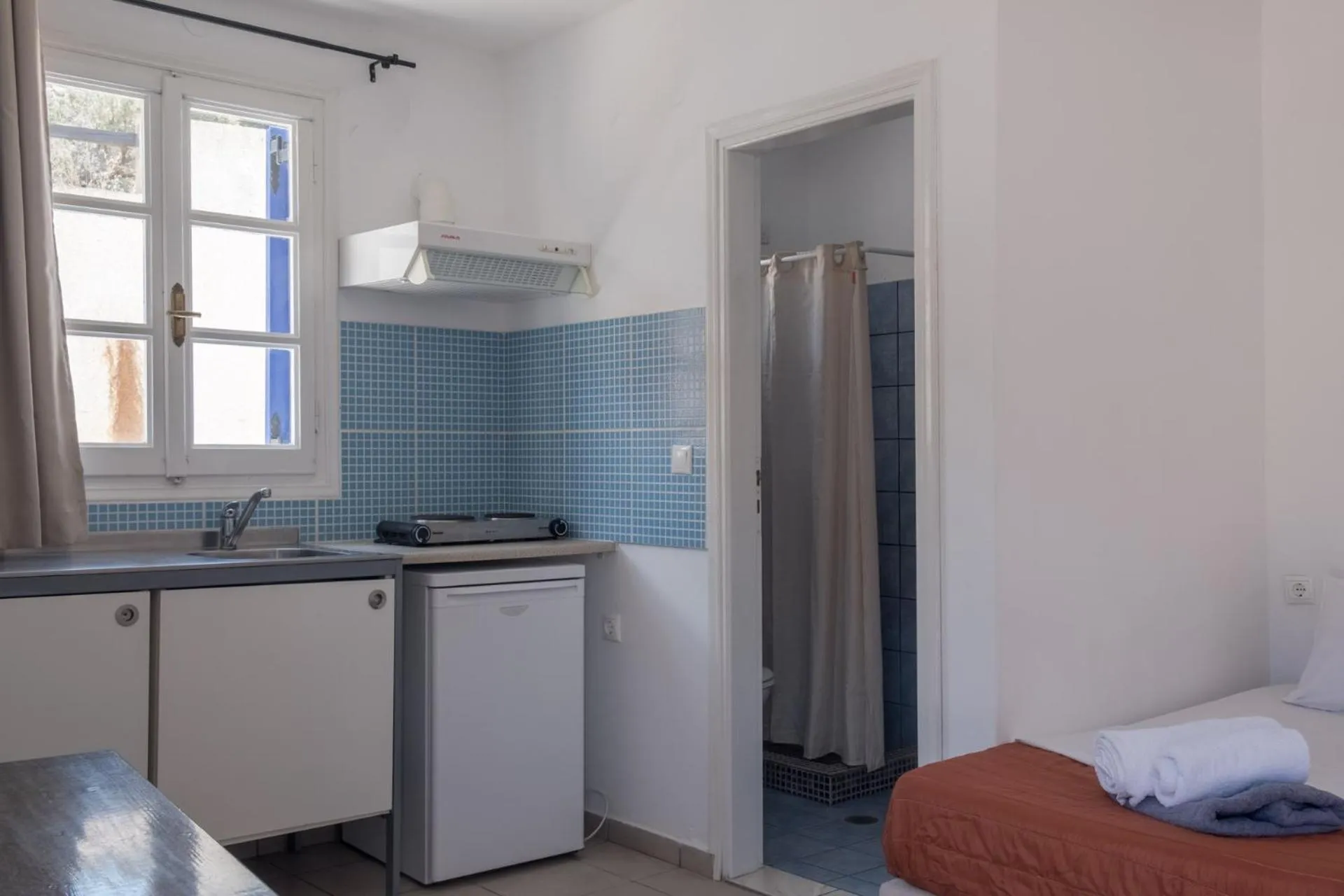 Bed in Paradise Apartments Studios