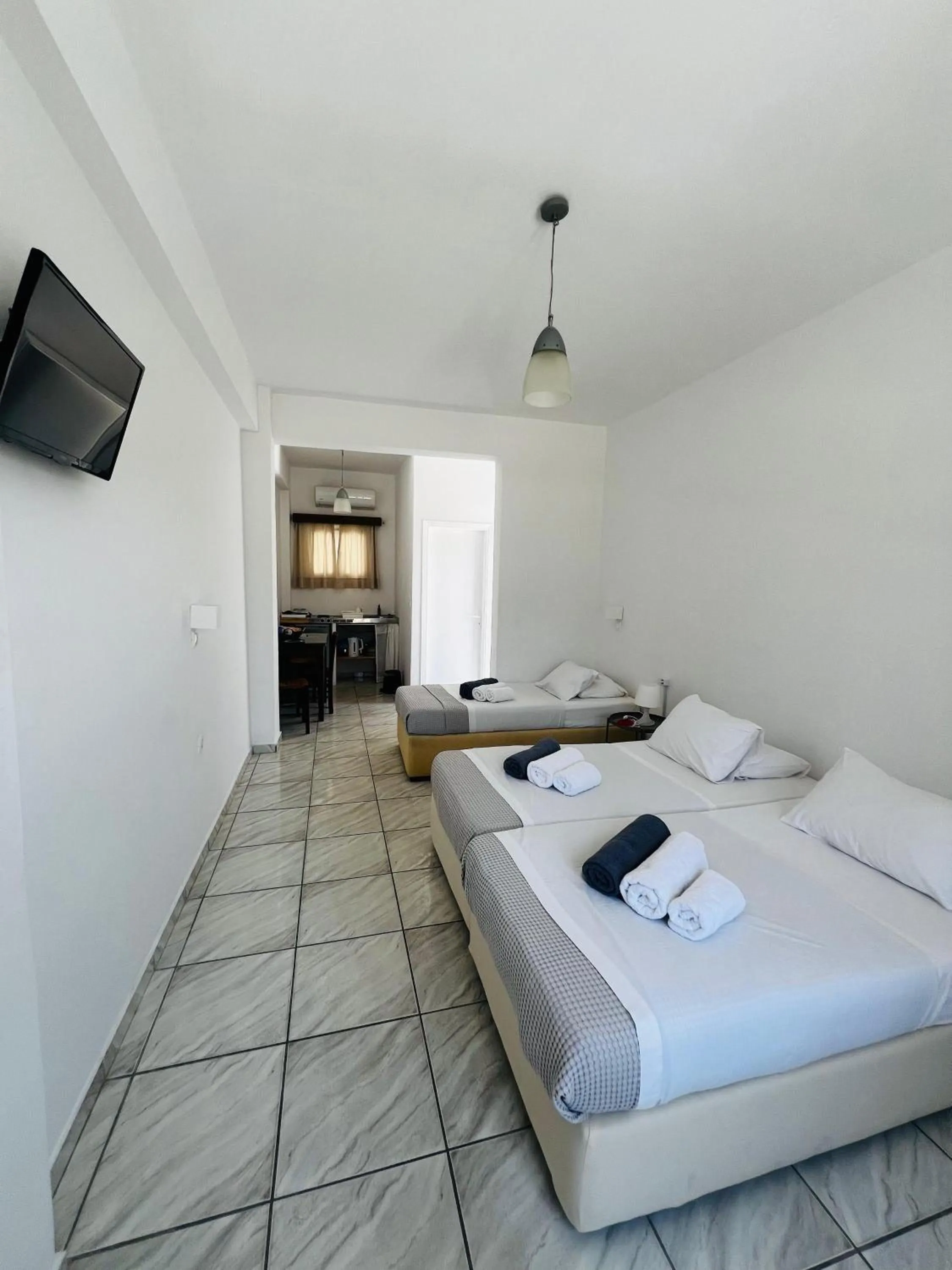 Bed in Paradise Apartments Studios