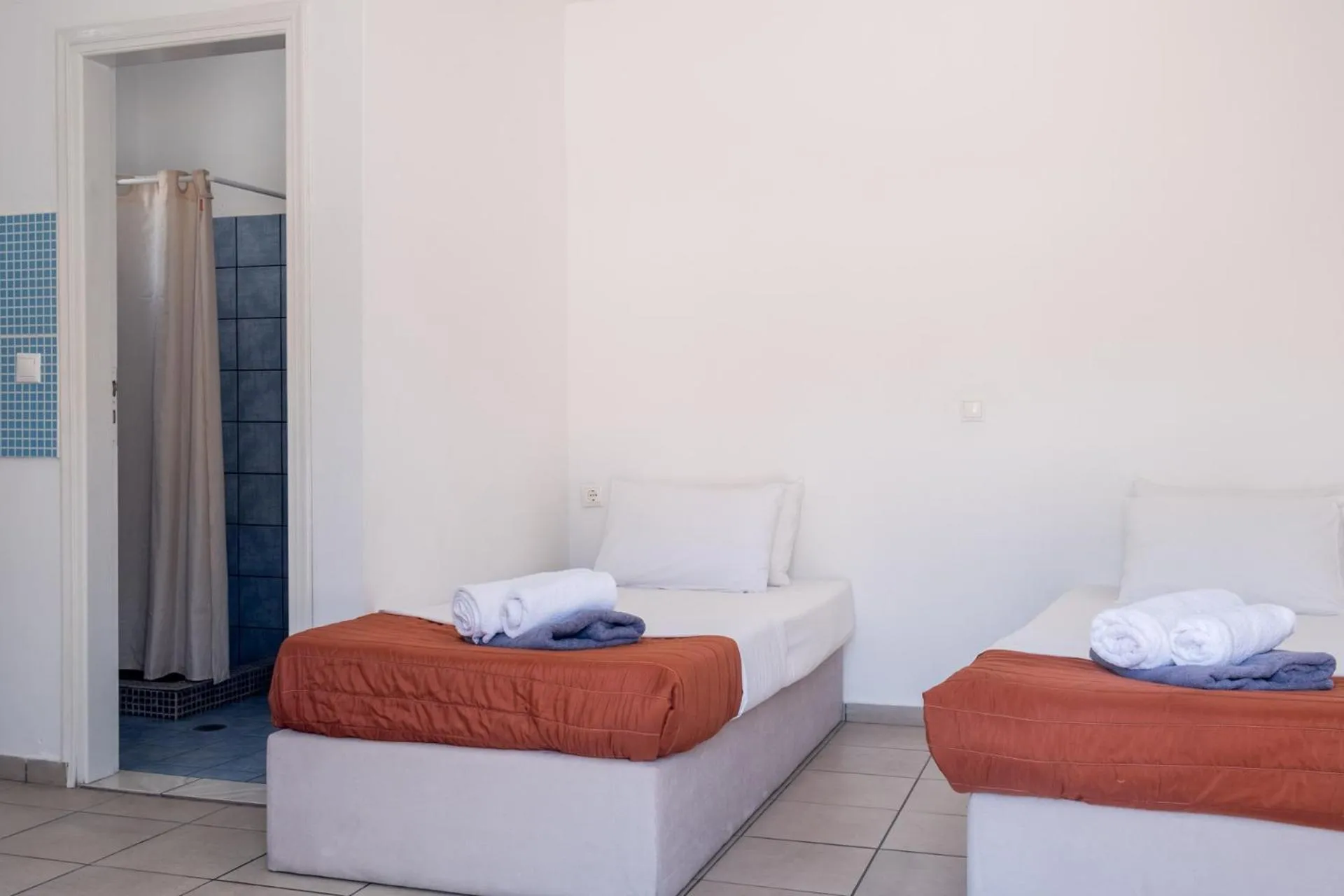 Bed in Paradise Apartments Studios