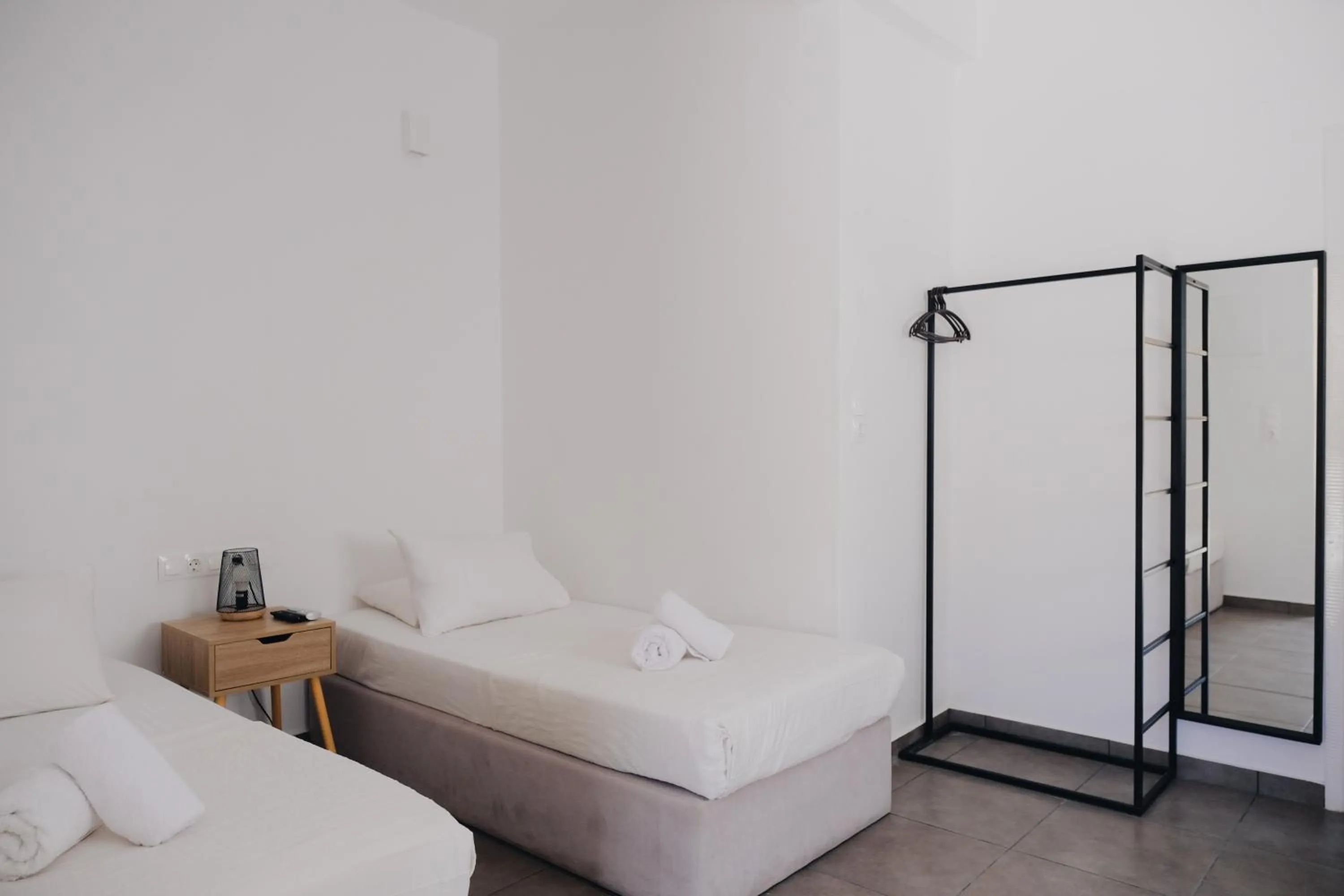 Bed in Paradise Apartments Studios