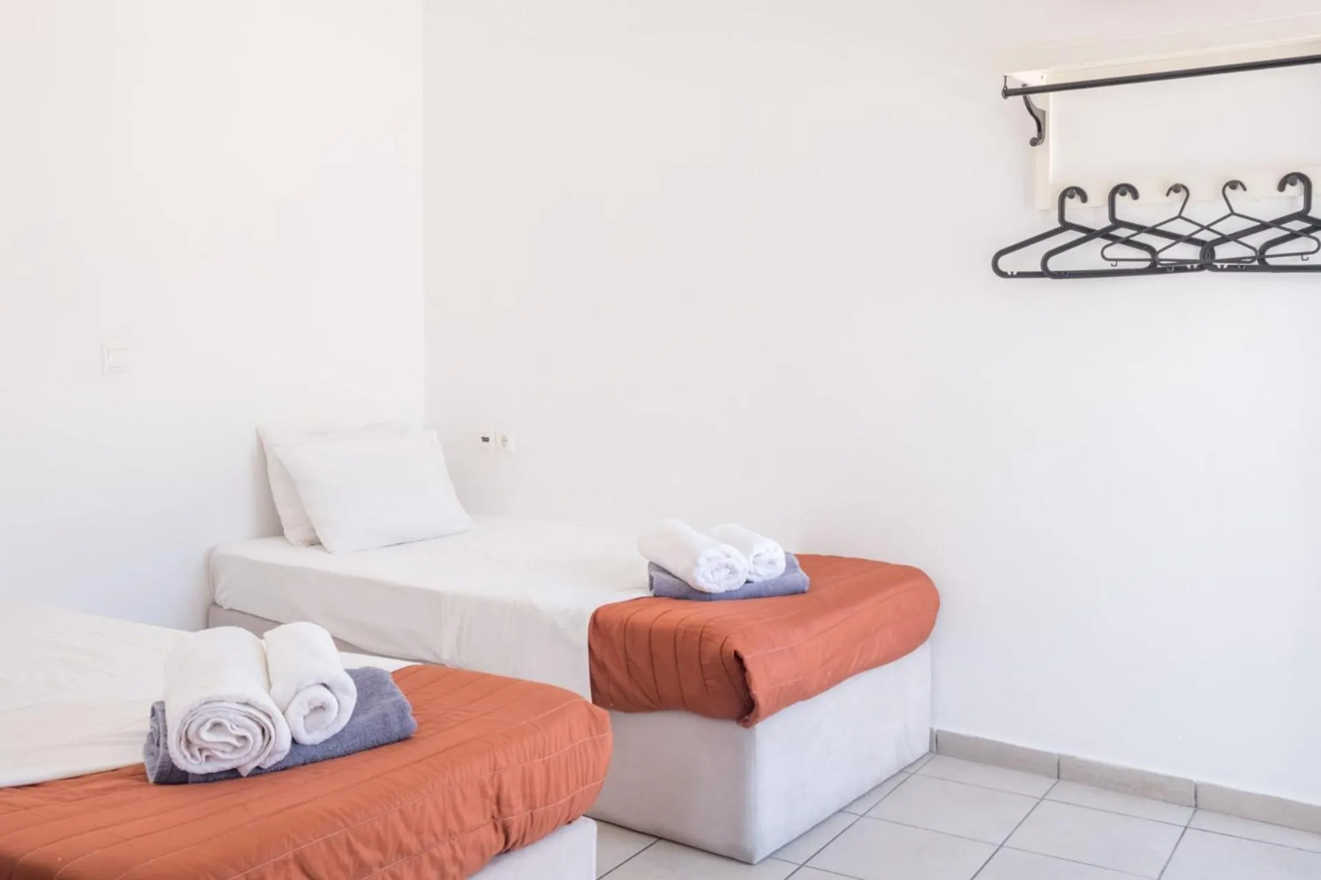 Bed in Paradise Apartments Studios