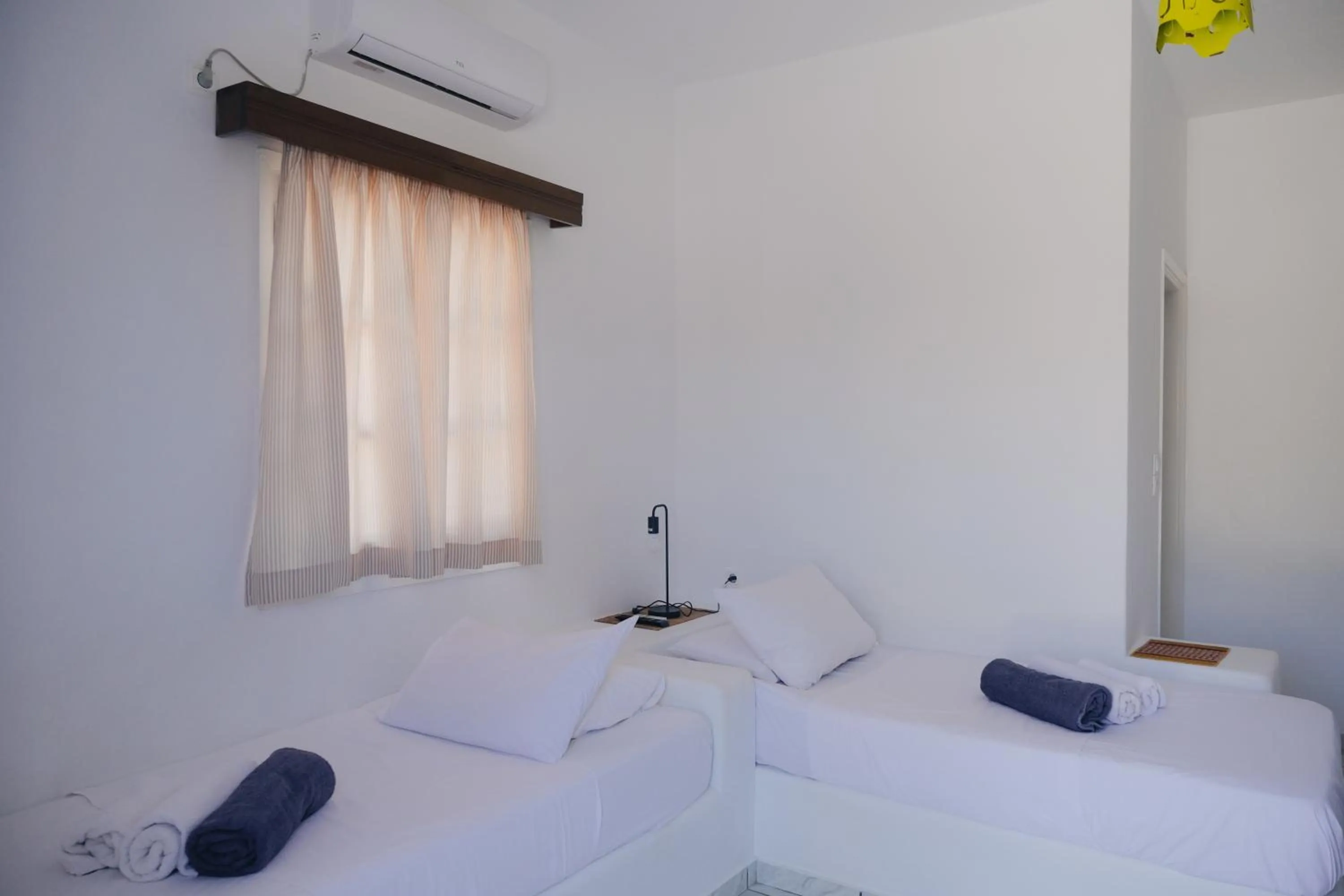 Bed in Paradise Apartments Studios