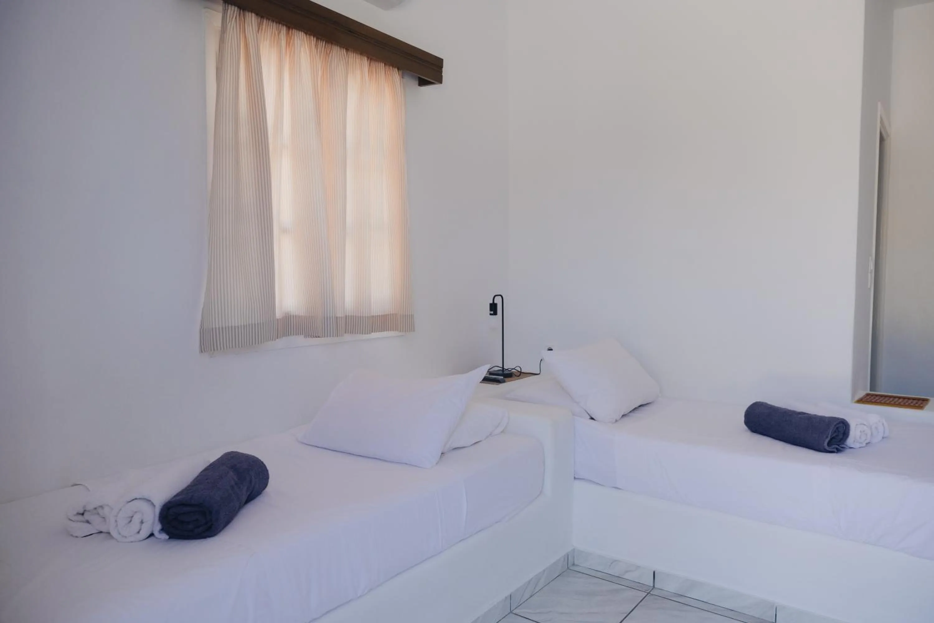 Bed in Paradise Apartments Studios