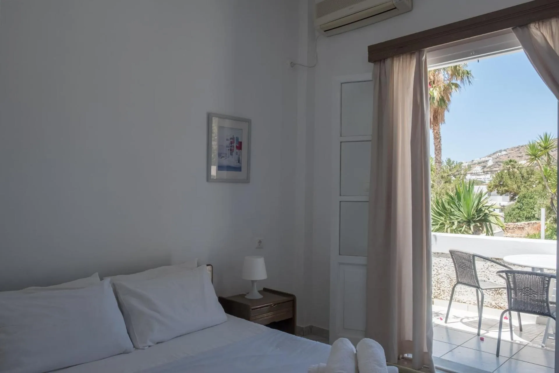 Bed in Paradise Apartments Studios