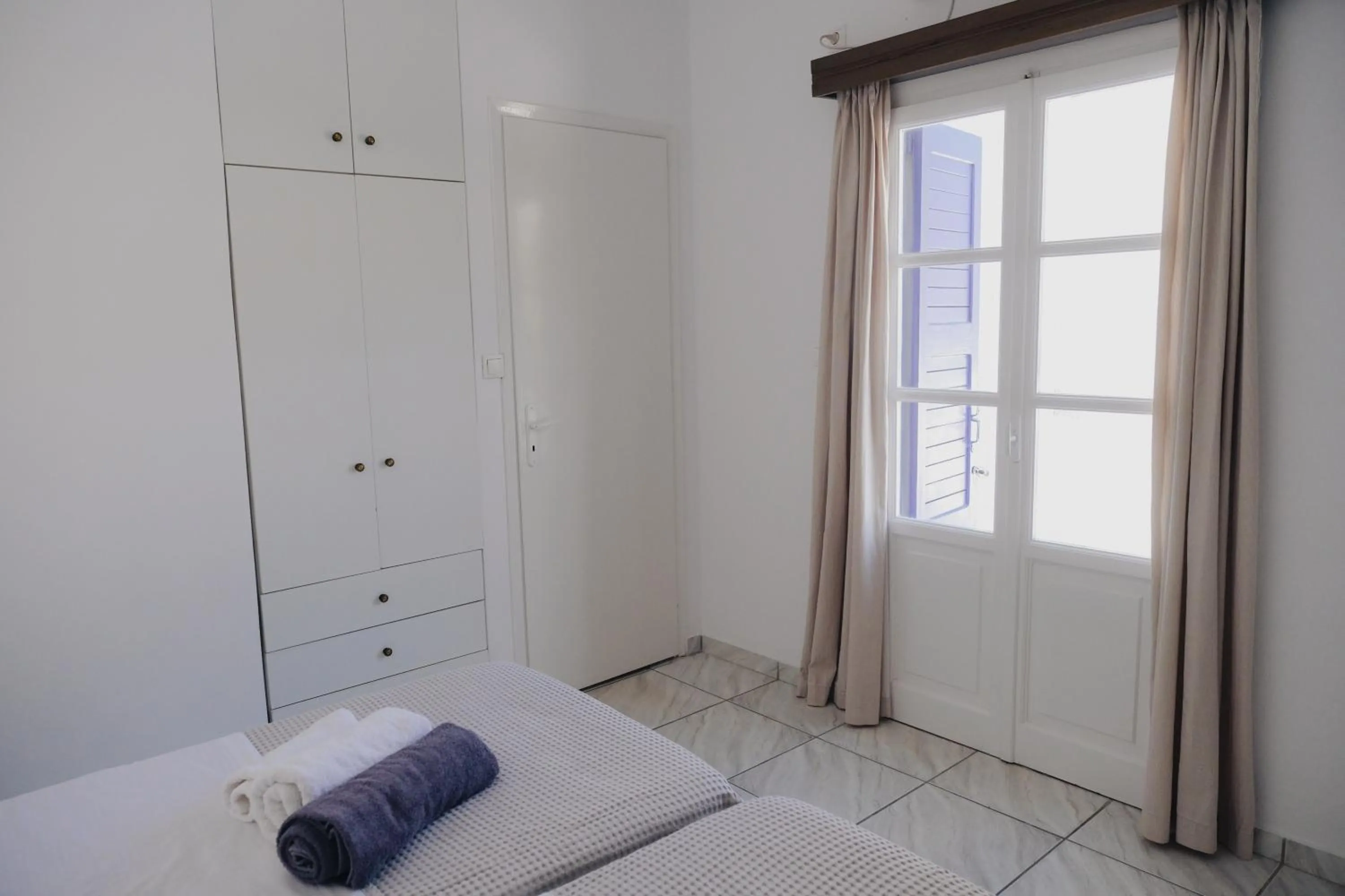 Bed in Paradise Apartments Studios