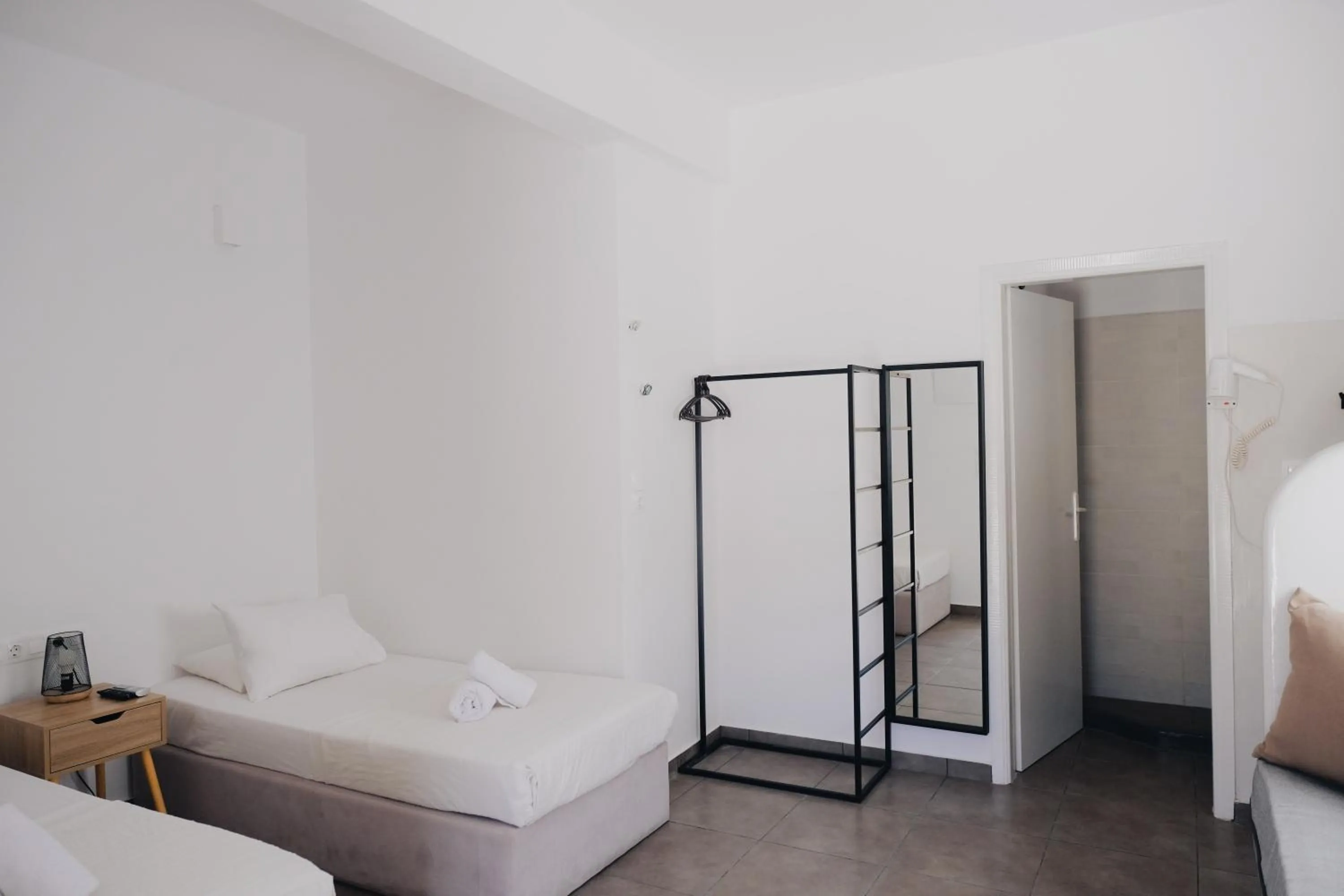 Bed in Paradise Apartments Studios