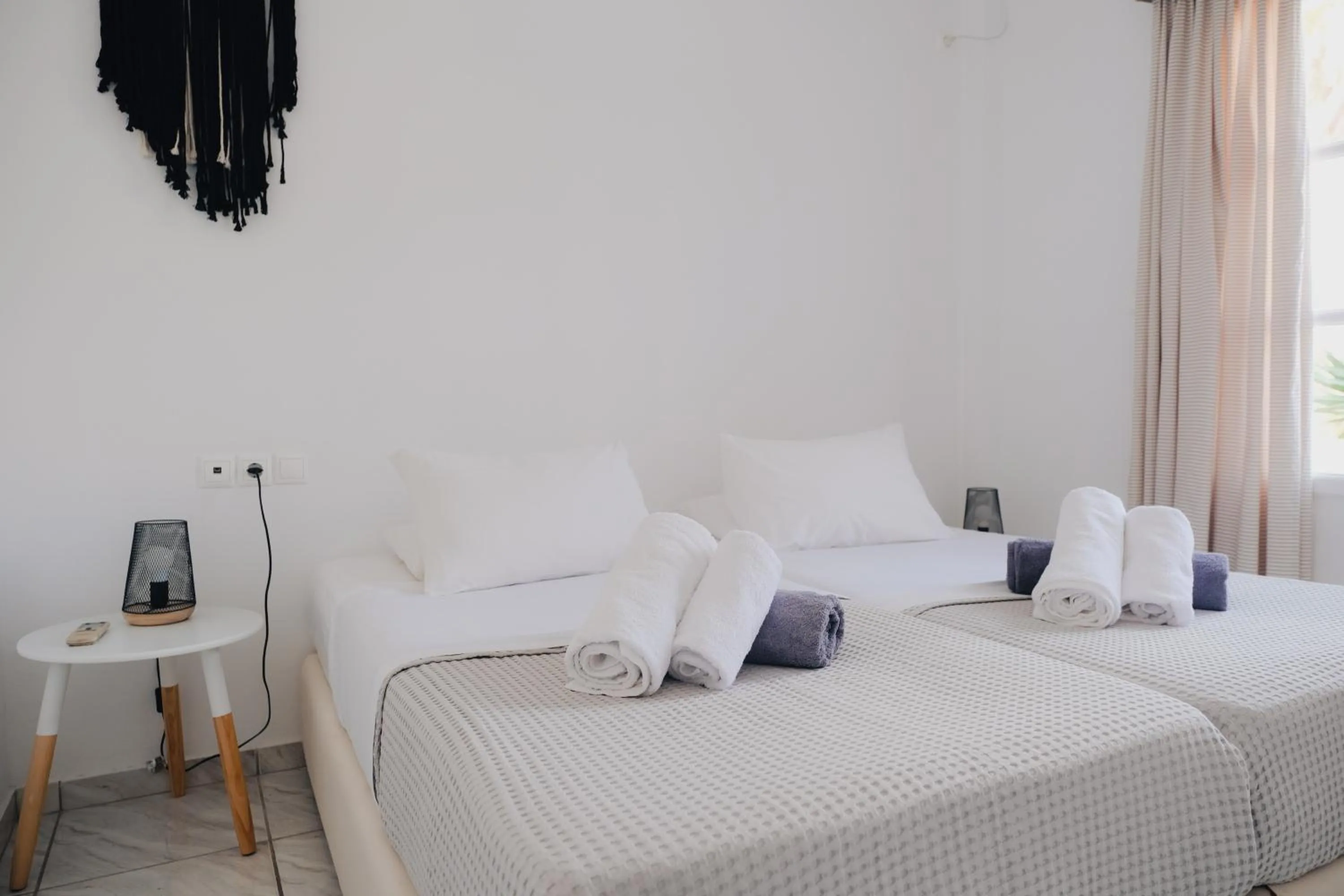 Bed in Paradise Apartments Studios