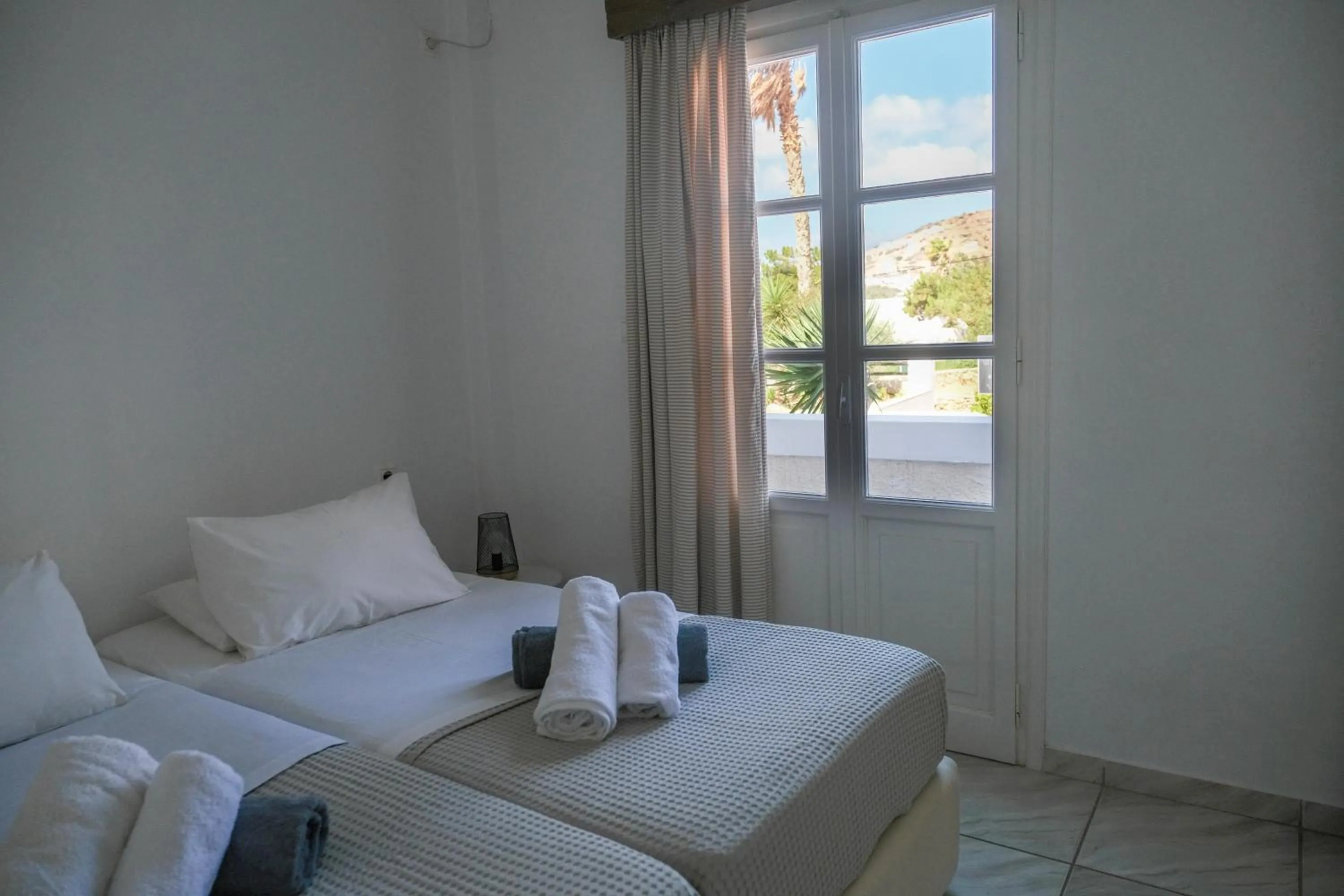 Bed in Paradise Apartments Studios