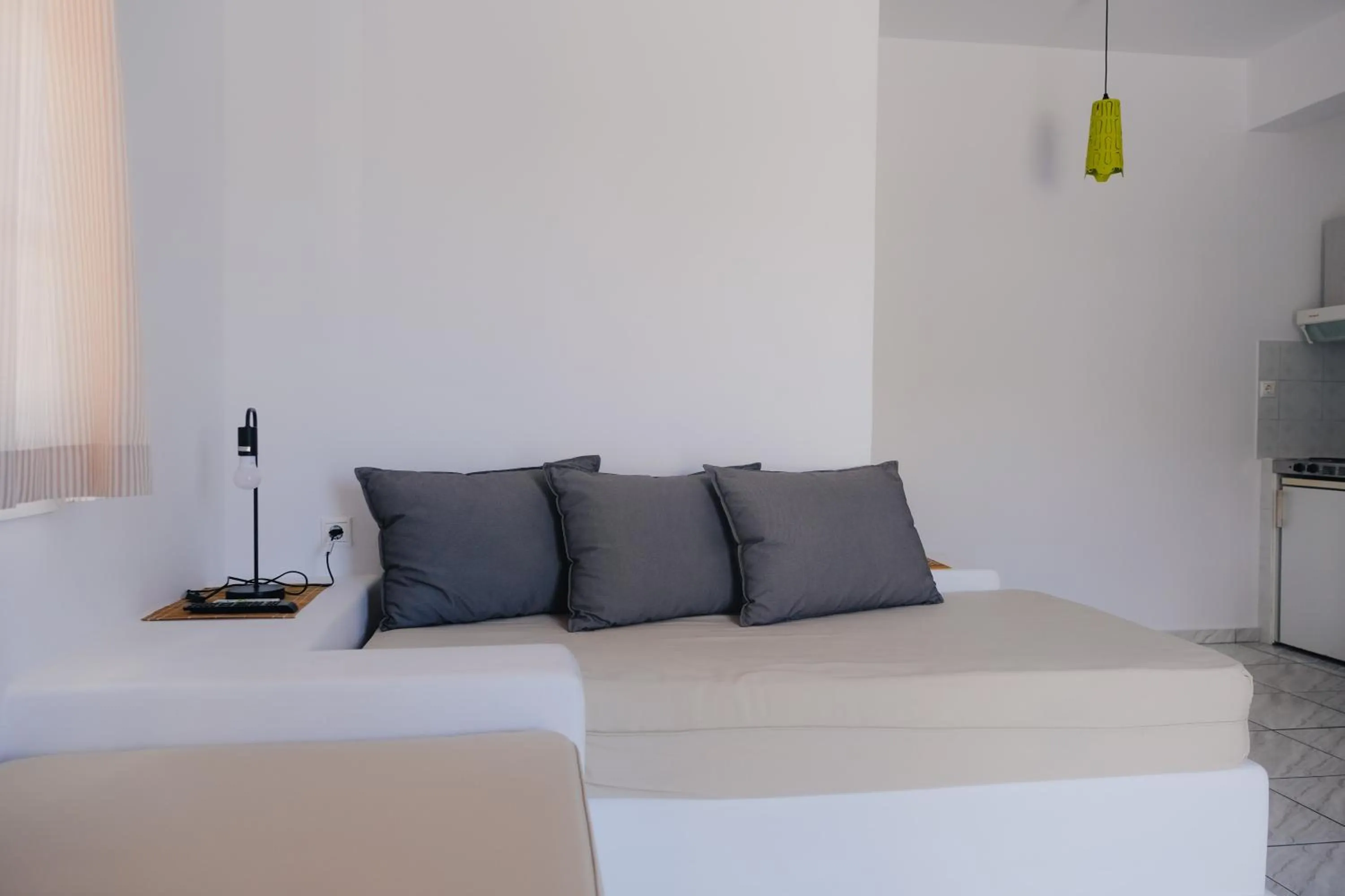 Bed in Paradise Apartments Studios