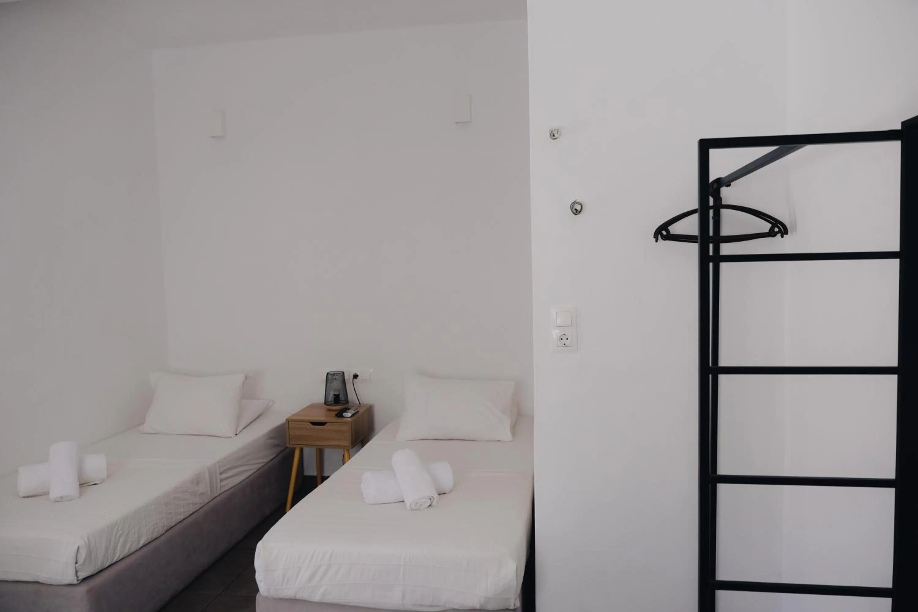 Bed in Paradise Apartments Studios