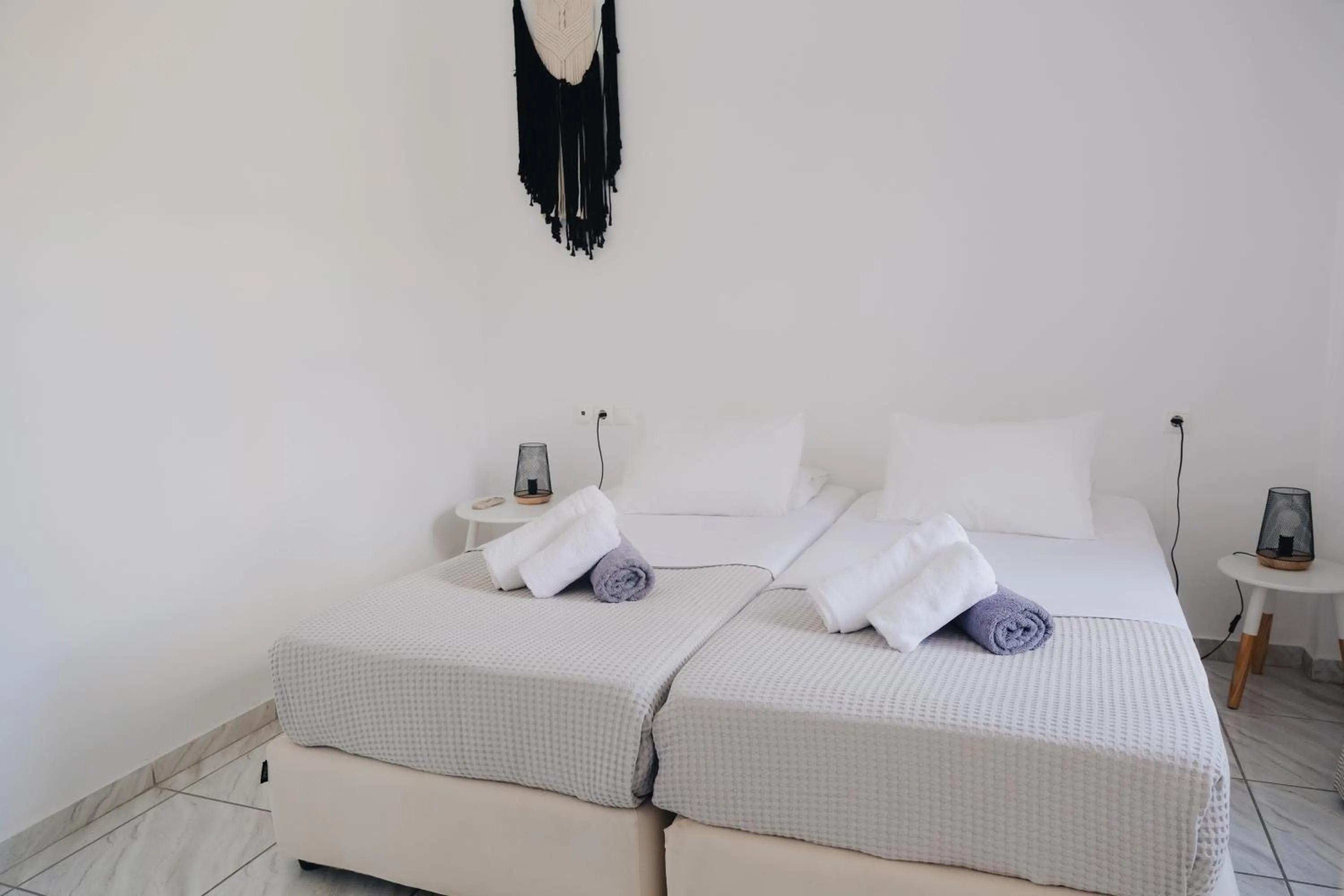 Bed in Paradise Apartments Studios