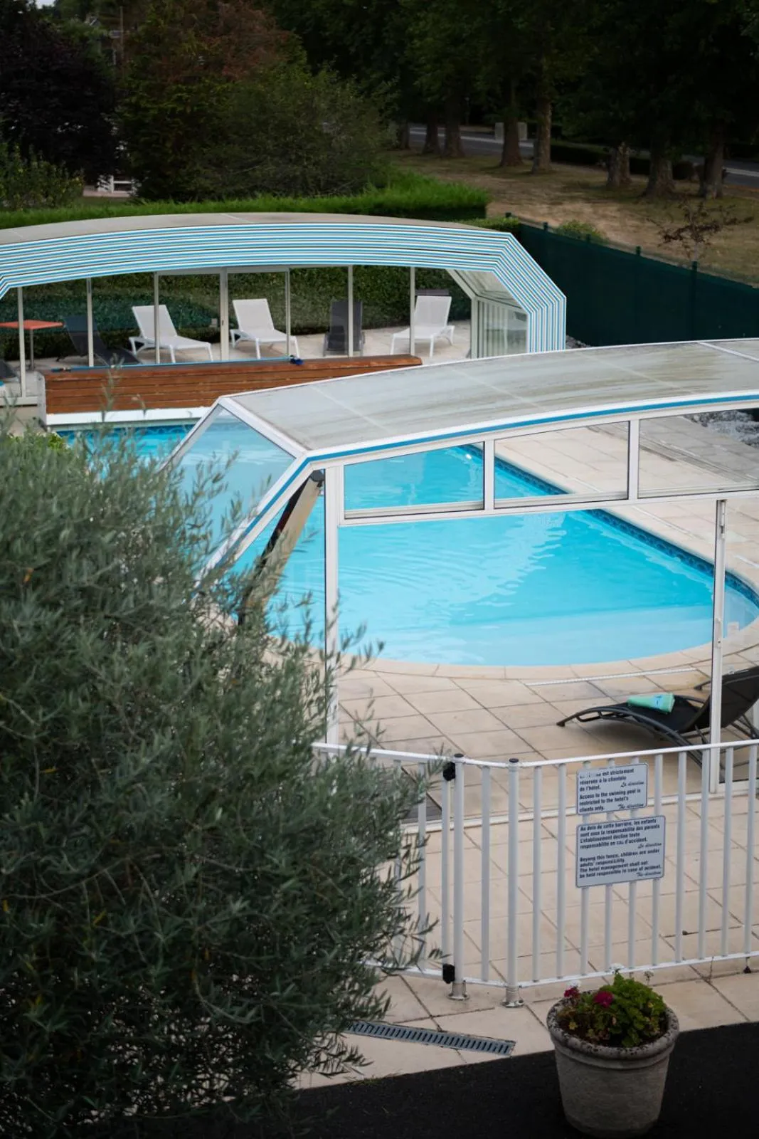 Swimming pool in Logis Hotel Restaurant L'Escapade