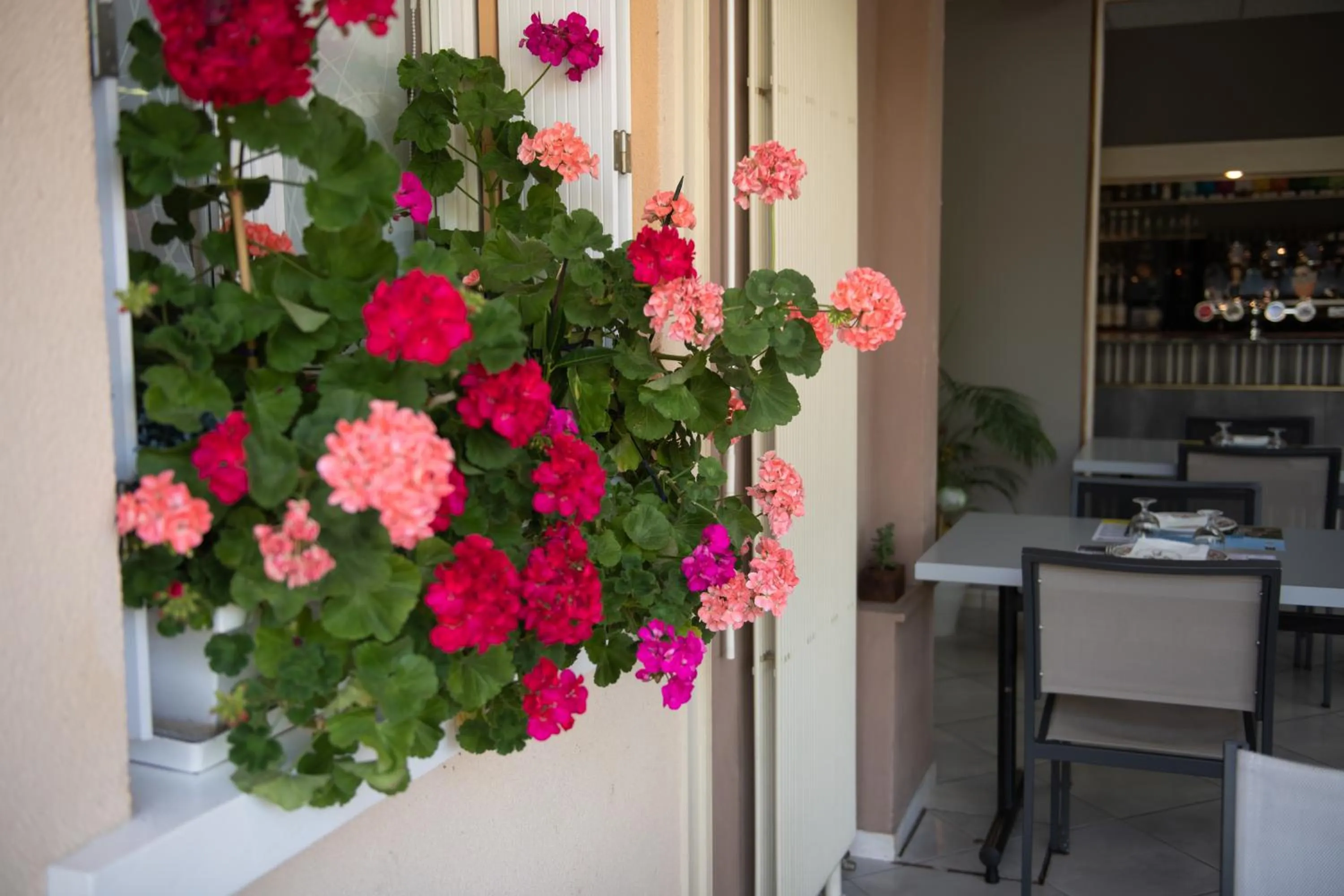 Patio in Logis Hotel Restaurant L'Escapade