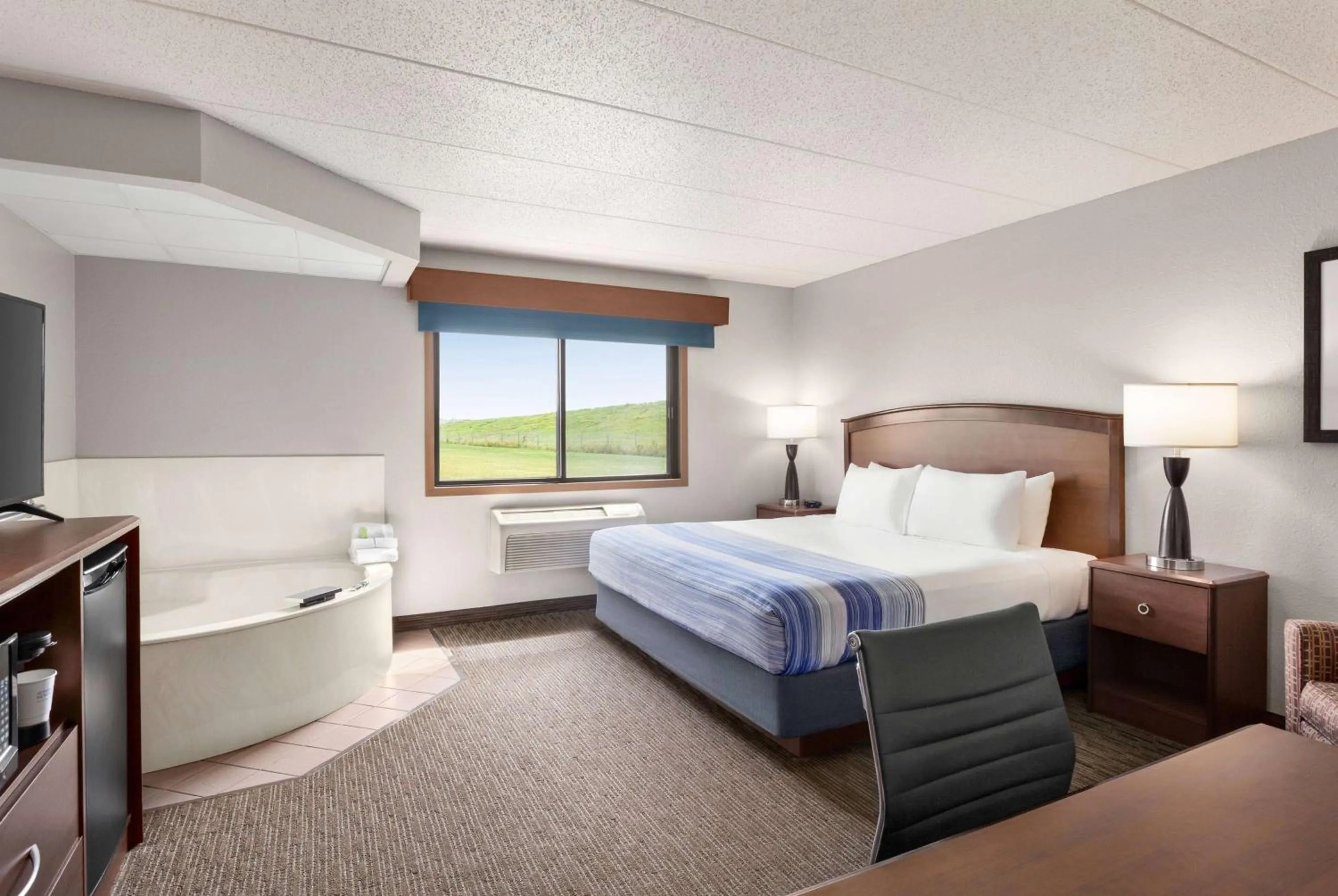 Photo of the whole room, Bed in AmericInn by Wyndham Fergus Falls Conference Center