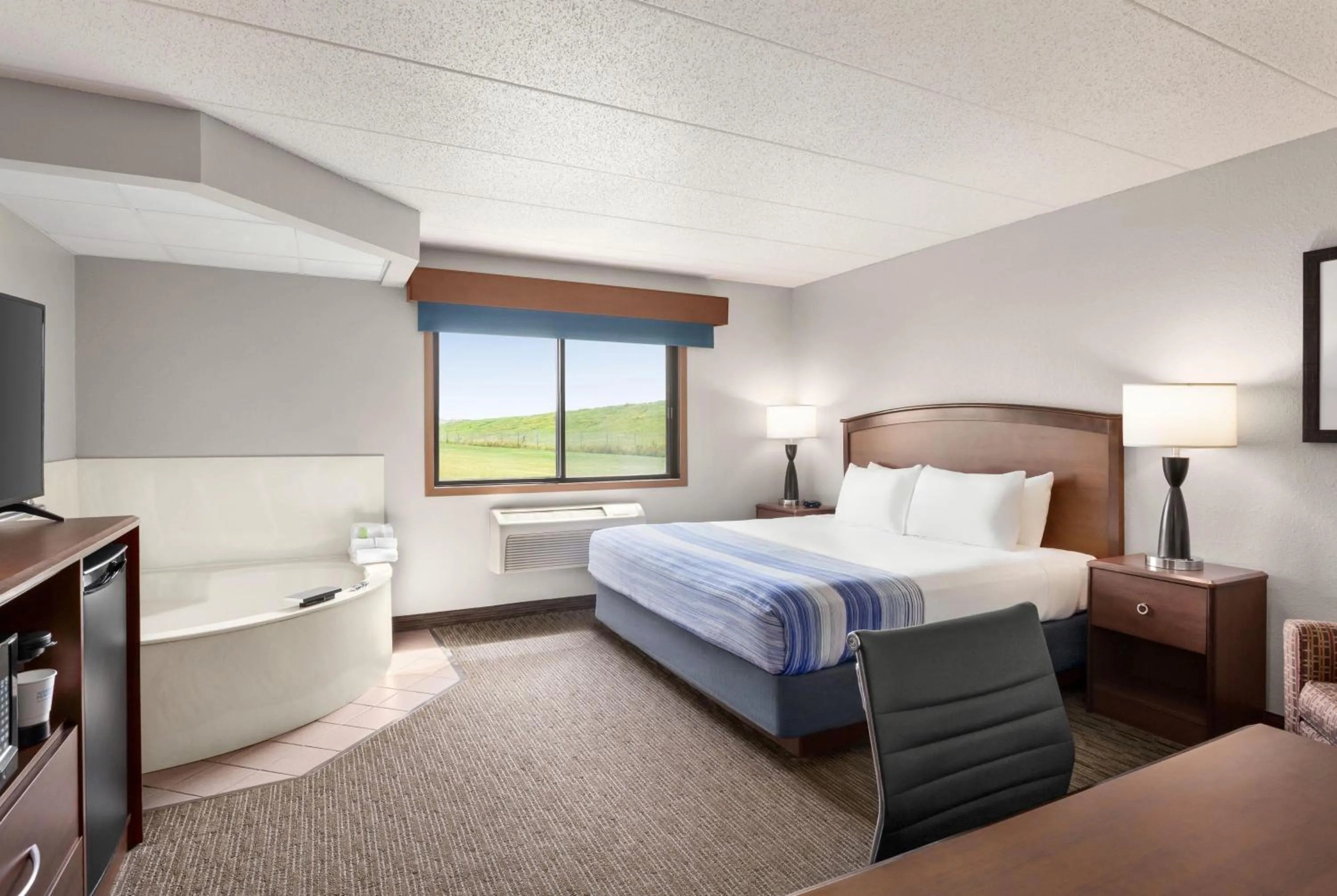 Photo of the whole room, Bed in AmericInn by Wyndham Fergus Falls Conference Center