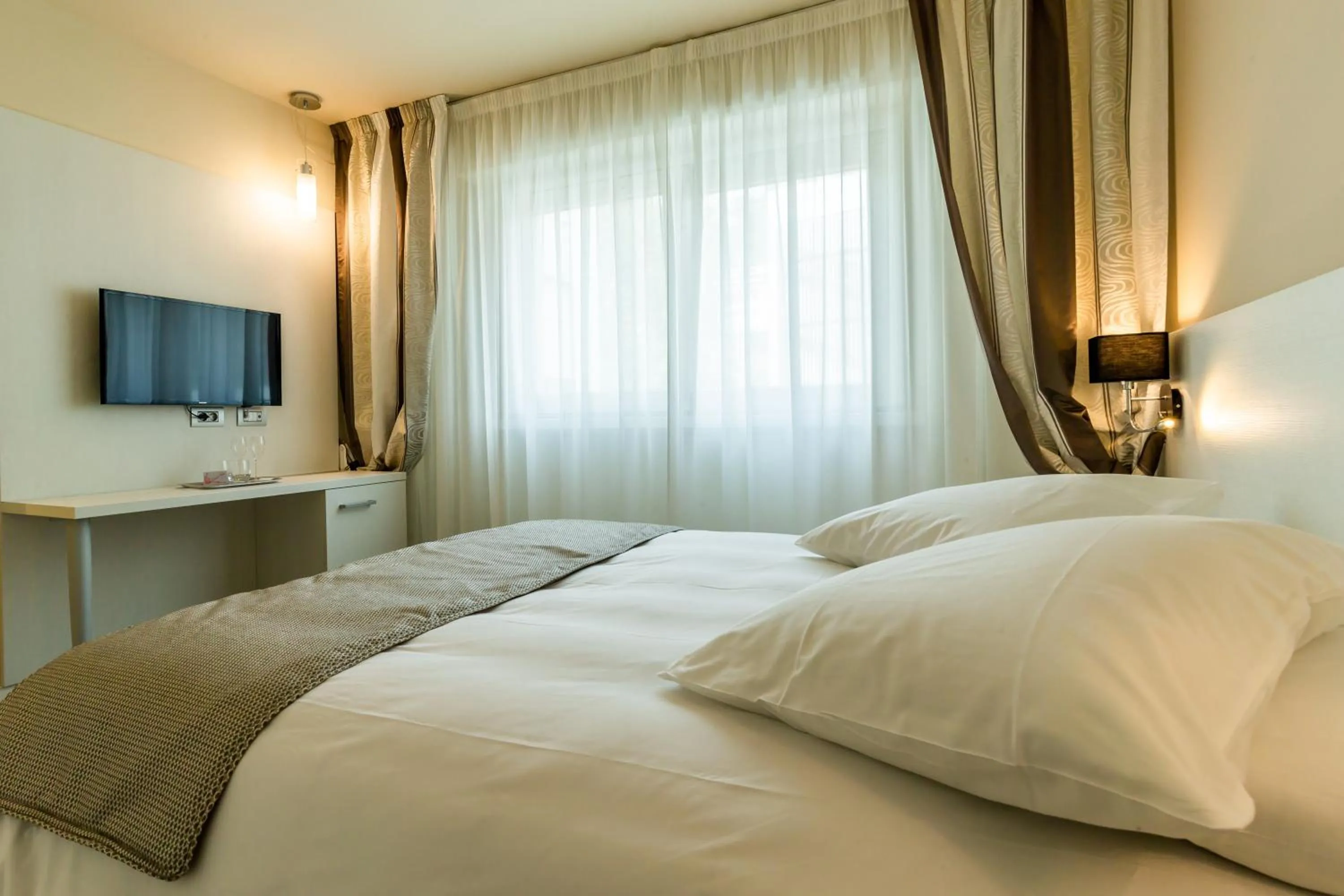 Bed in La Dolce Vita Hotel