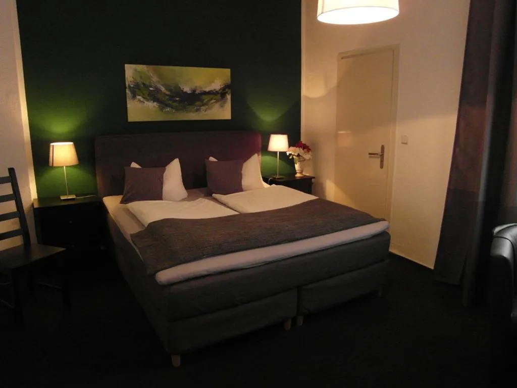 Bed in Hotel Frankfurter Hof