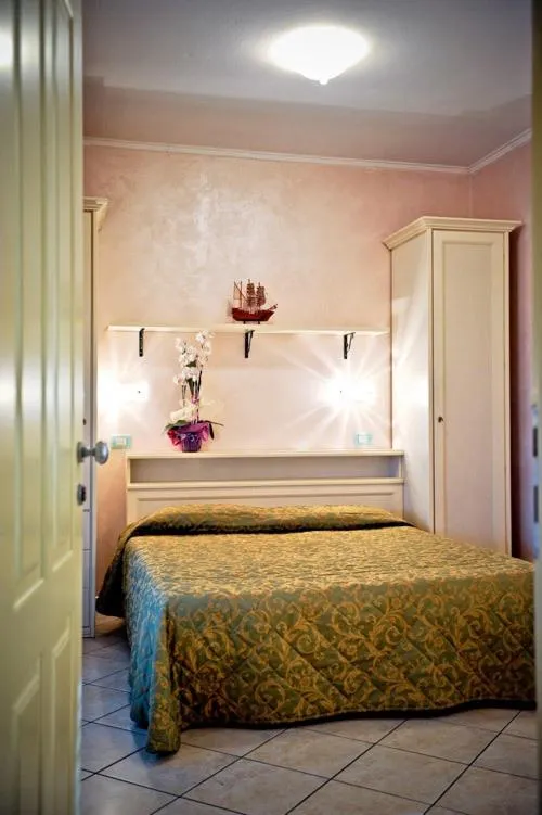 Bed in Hotel Residence Veliero