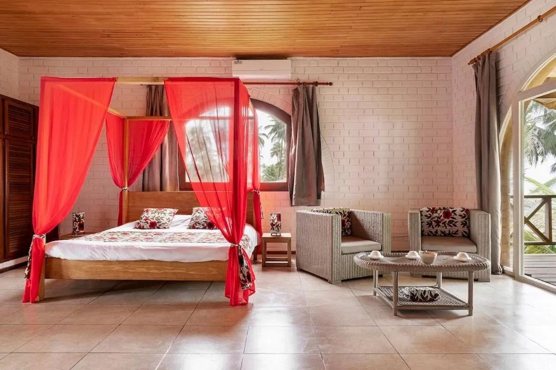 Seating area, Bed in Hotel Coucoue Lodge
