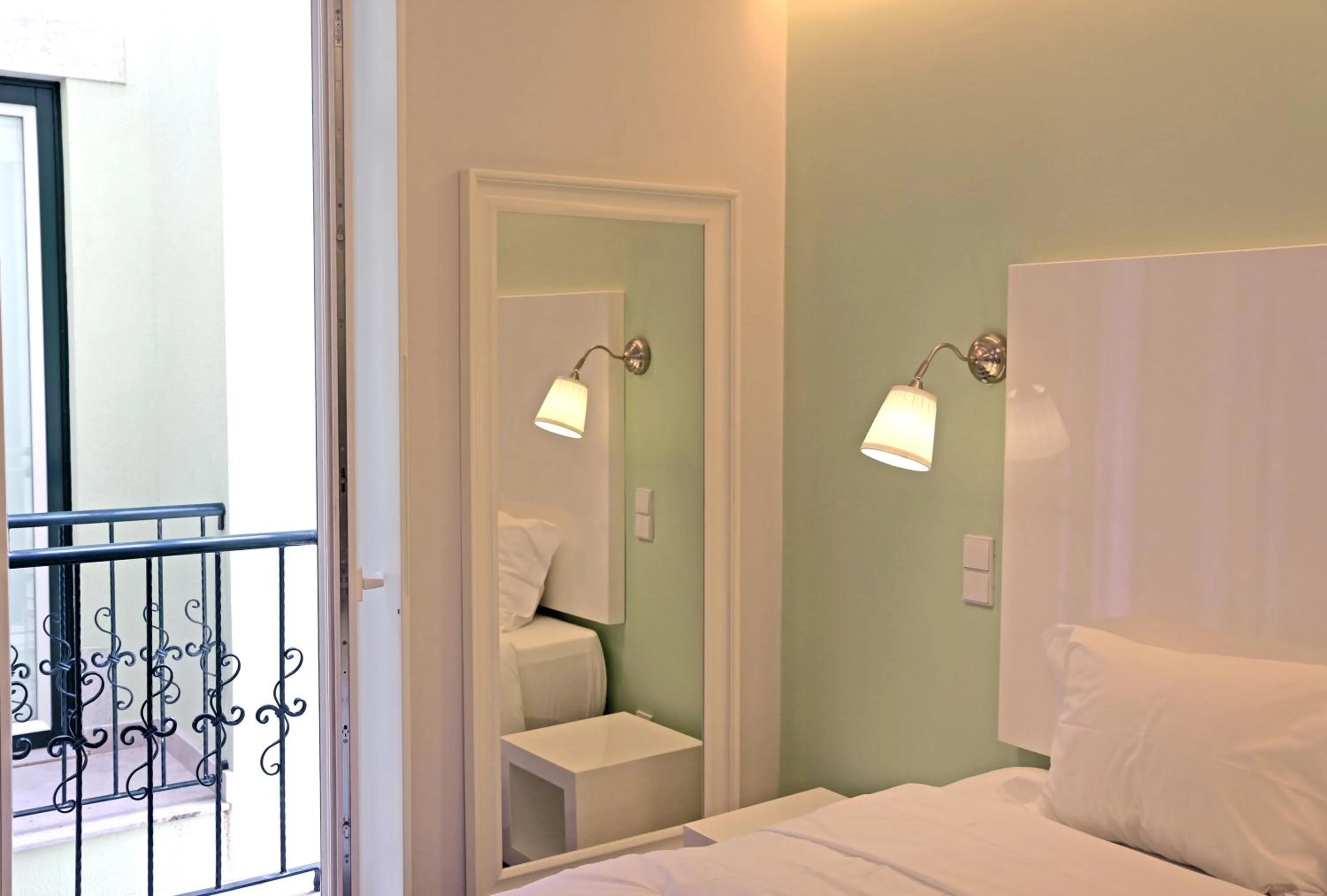 Decorative detail, Bed in Lisbon Colours Bairro Alto Apartments