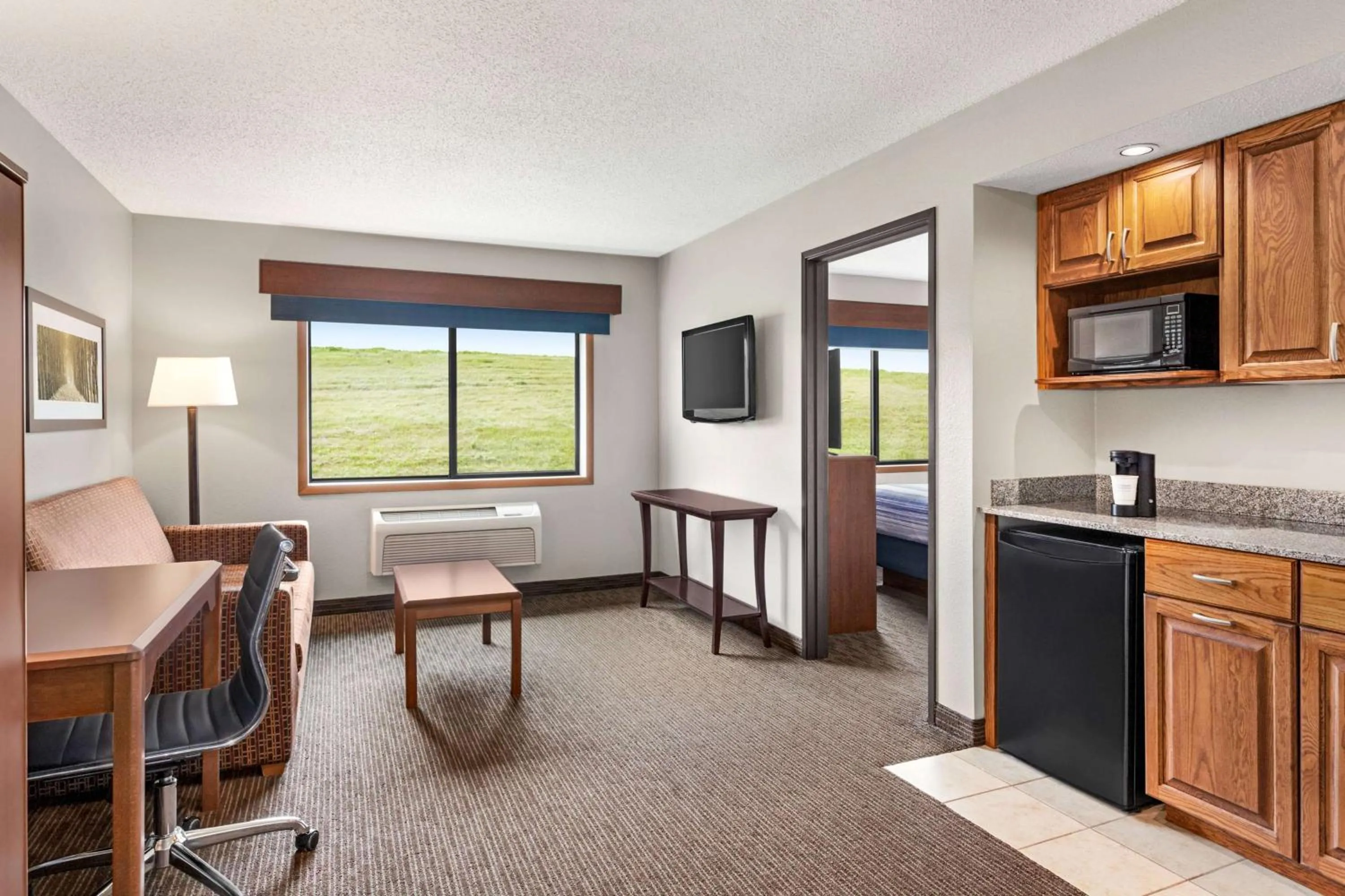 Bed in AmericInn by Wyndham Sauk Centre