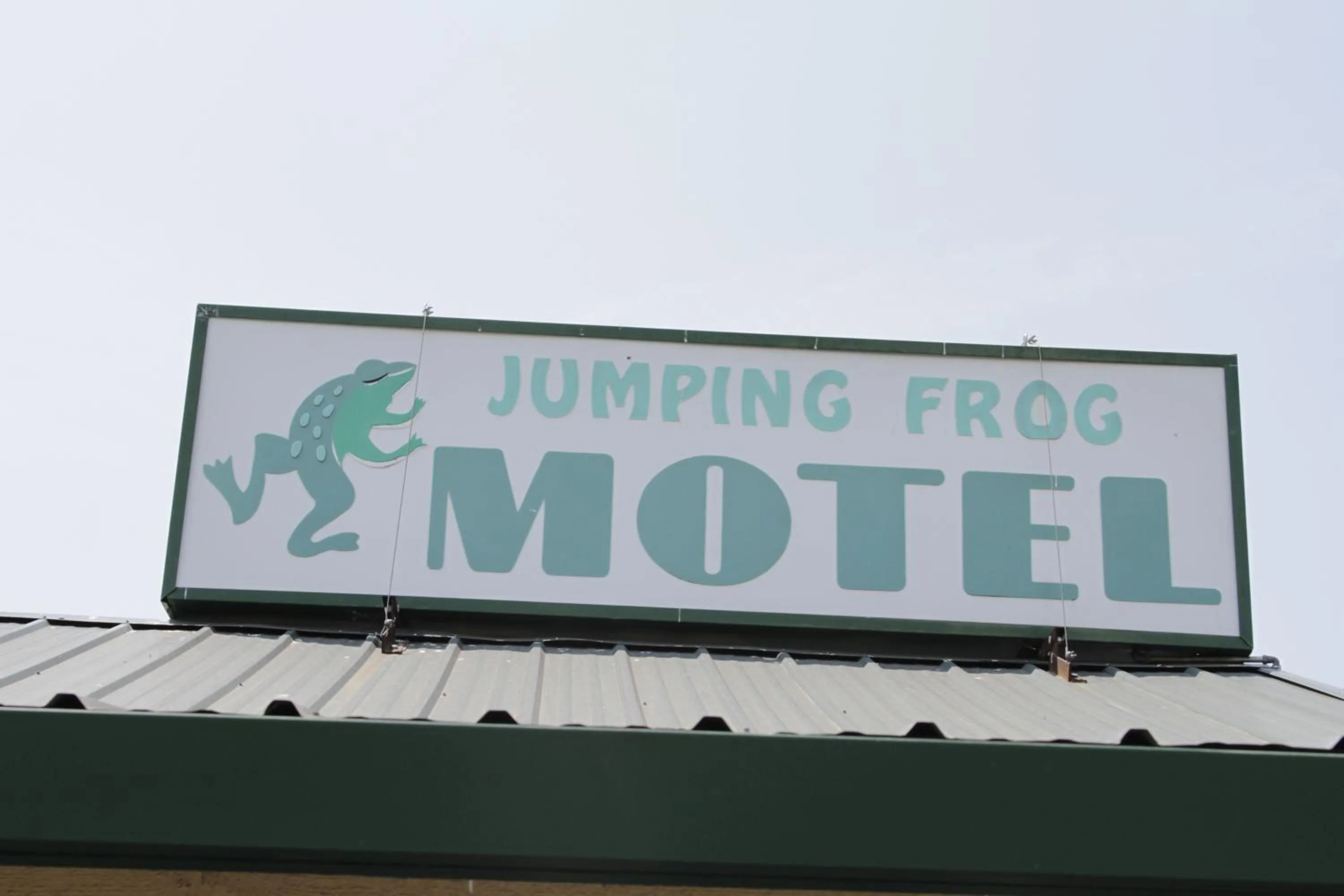 Property logo or sign in Jumping Frog Motel