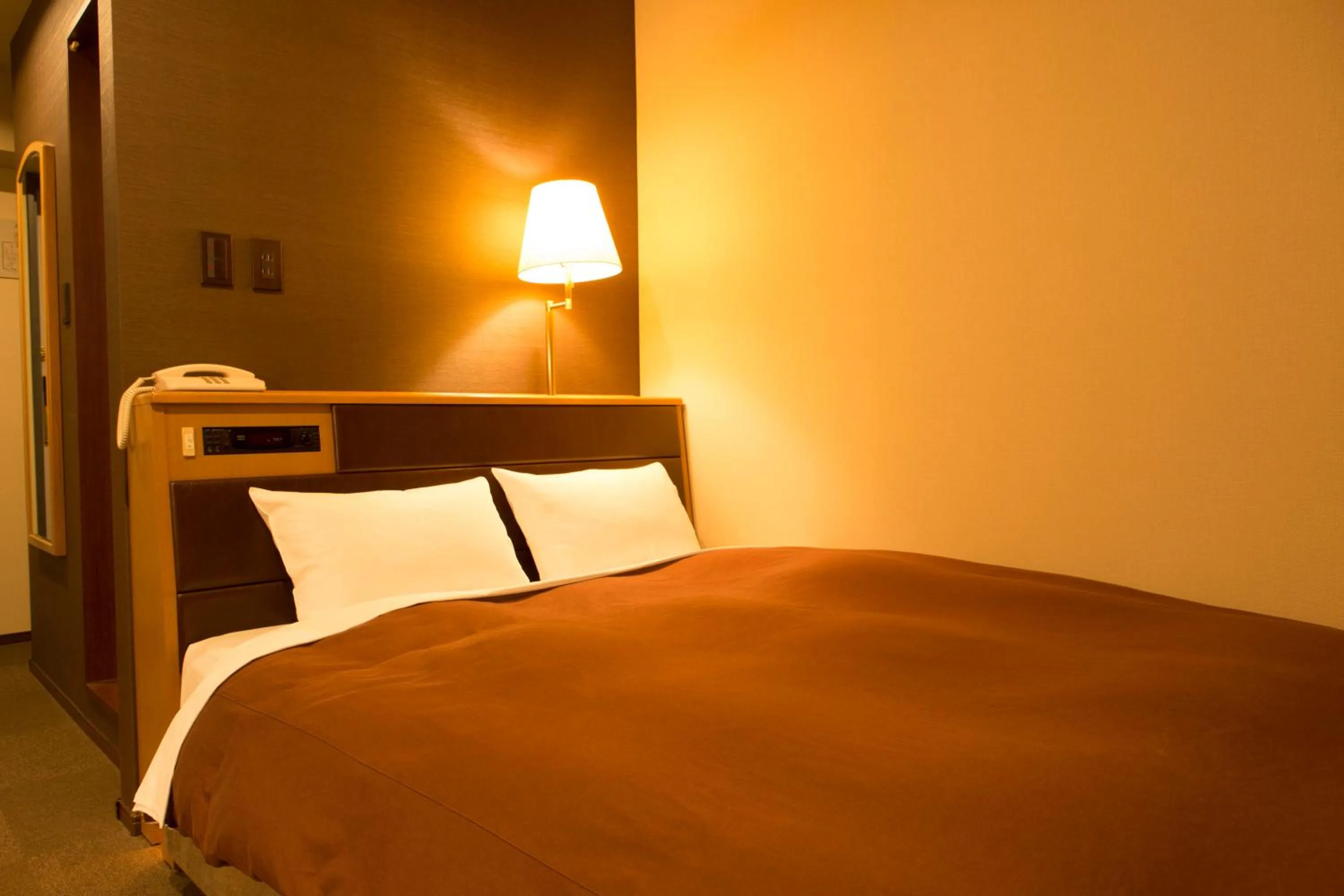 Bed in Nisshin Namba Inn