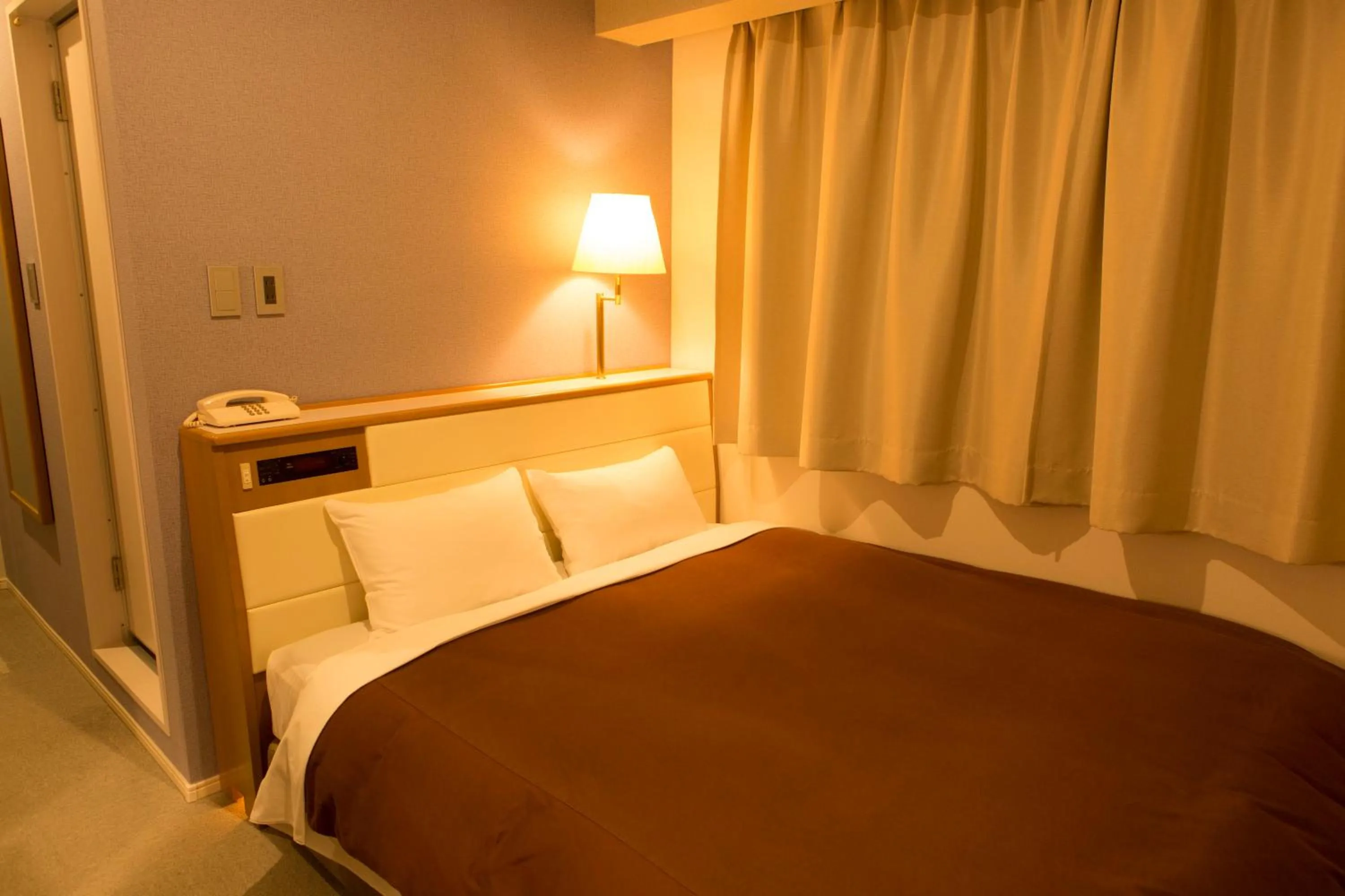 Bed in Nisshin Namba Inn